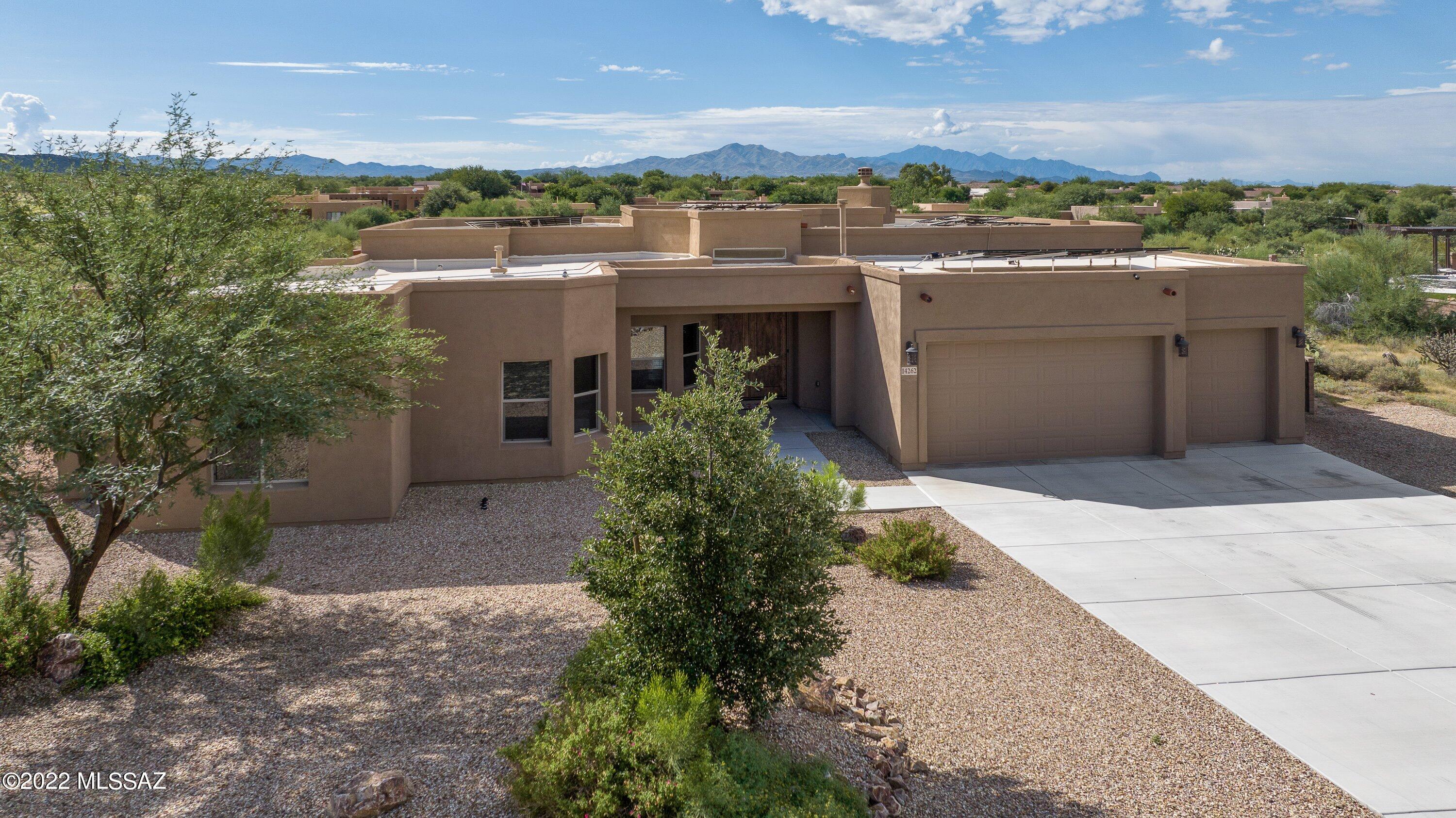 WINNER of Best Home by Tucson Asociation of Realtors Home Tour!! This 3 yr old Contemporary Southwest Sombra Built Home is a MUST SEE!  2950 sq ft, 4 Bedroom Split Floorplan, Office, 3 baths,  Gourmet Kitchen w/ Granite Countertops overlooking a Spacious Great Room w/ Fireplace and Double Patio Doors leading to the Tropical, Resort-like Backyard, Pool, Waterfall, Spa, Outdoor Kitchen and Mountain Views!!  The Large Irrigated .9-acre lot has easy care Natural Desert Landscaping,  Garden Spot  and Fruit Trees. The Tesla Solar System with Back-up Batteries is paid for!! Vail Schools!