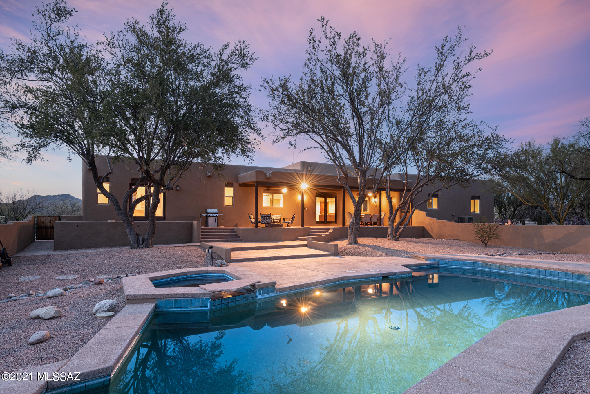 Spectacular home with guest house located on an expansive 4.68 acre lot featuring Catalina mountain and sunset views. Thoughtful split floorplan designed around a central kitchen, great room, living room and formal dining room. The spacious kitchen includes stainless appliances, granite counters, and island and breakfast peninsula. Enjoy the desert breeze on the calming covered patio, or cool off with a dip in the pool. The one bedroom guest house with kitchen and living room is separated from the main home by a paved path and offers a separate drive and parking. Rest easy knowing major items have already been upgraded. New roof, stucco and windows in 2017. Three new HVAC systems, main house water heater and dishwasher in 2019. New pool pump and filter in 2020. New carpet 2021.