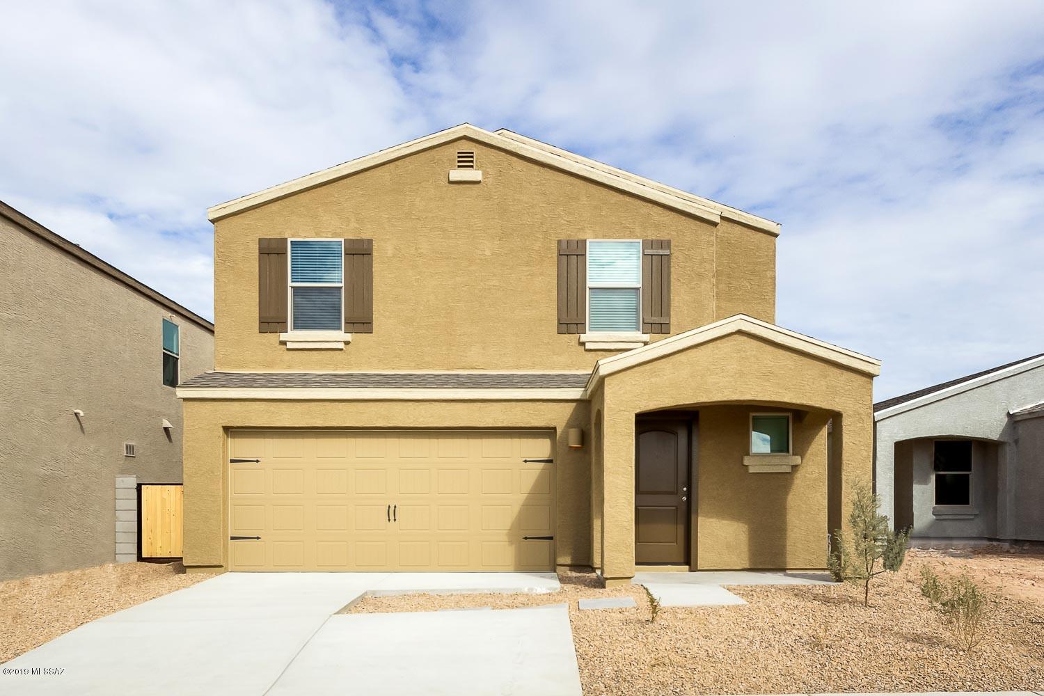 The Palo Verde is a beautiful, two-story home featuring an open floor plan with 5 bedrooms and 3 full baths. This home includes energy-efficient kitchen appliances, granite countertops, a fully-fenced backyard, front yard landscaping and an attached two-car garage. Whether upstairs or down, you will find an abundance of space for entertaining guests in this home! The gorgeous kitchen includes a center island and overlooks a spacious dining and living area. In addition, the spacious loft area upstairs can be used as a media or game room. Another highlight of this home is the downstairs guest room. The Palo Verde is found in the neighborhood of Cantera, which is located near a variety of entertainment opportunities. To schedule a tour of this home, please call 520-849-6120 ext 19.