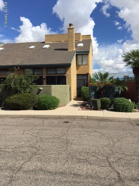 Uniquely designed Town Home with a two Car attached garage, conveniently located to the UofA, River Walk, Tucson Racquet Club, Restaurants, and Shopping. First floor with decorative, hard finished floor, Two nice-sized Master Bedrooms w/attached Baths and walk-in closets, plus a Loft with Fireplace and Custom Wet Bar. Overlooks the Rillito River with Mountain Views. Conveniently located next to the community pool/spa. All appliances stay. Newer HVAC installed in 2008. A very nice value when compared to recent Sold Comparables! Photos are from period of Owner's occupancy, property is currently vacant.