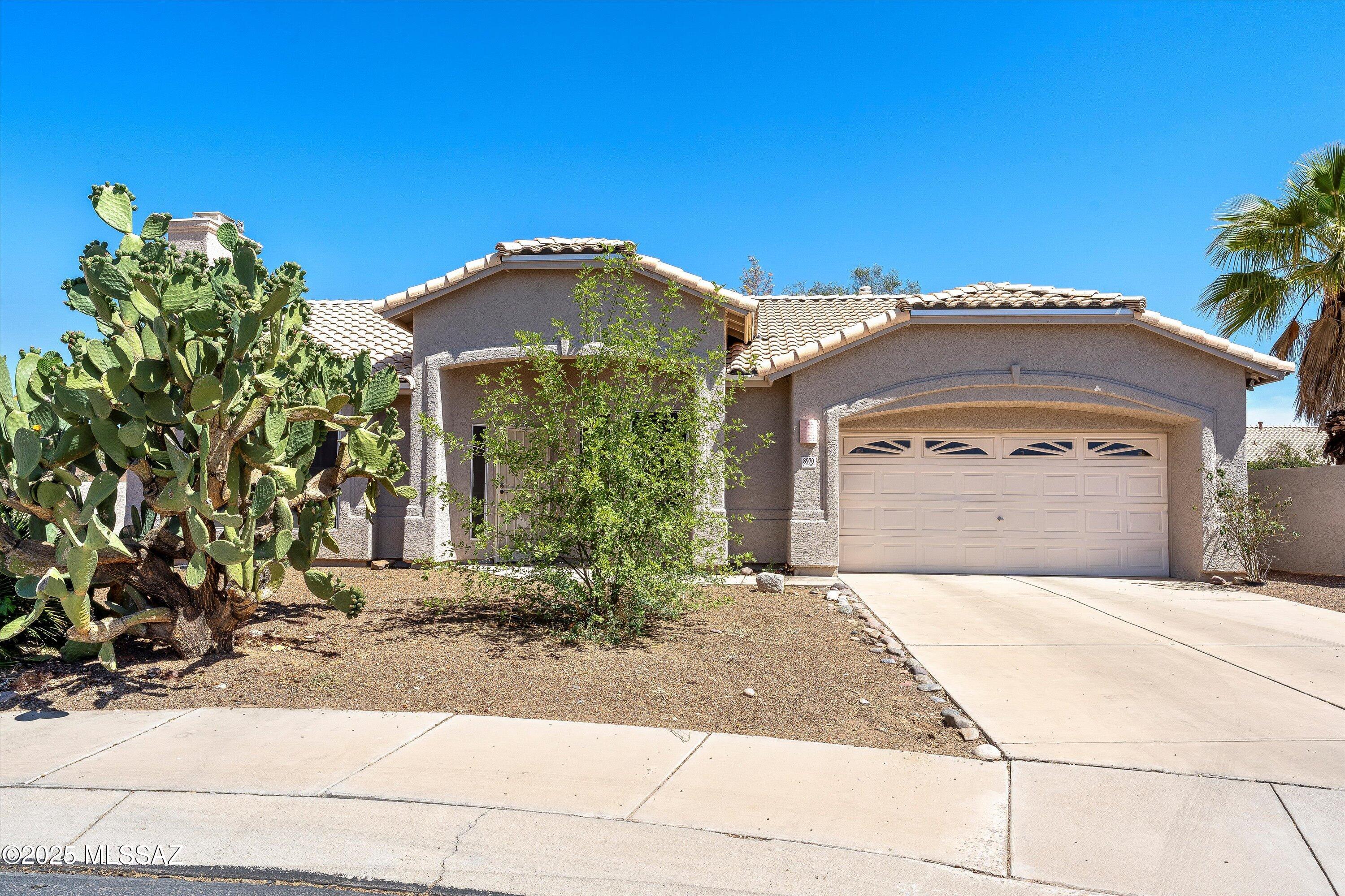 Explore this family-friendly 3BED/2BATH/2CAR home in Continental Ranch! Located conveniently close to I-10, dining/shopping establishments and walking distance to the bike loop. New roof April of 2025! HUGE prickly pear cactus in front adds that AZ charm! Inside you'll find vaulted ceilings & gas fireplace. Kitchen features real wood cabinets, white appliances & sliding glass doors to covered back patio & spacious yard. Large primary bedroom with ensuite featuring dual vanity, jetted soaking tub, & walk-in shower! Don't wait, come see today!