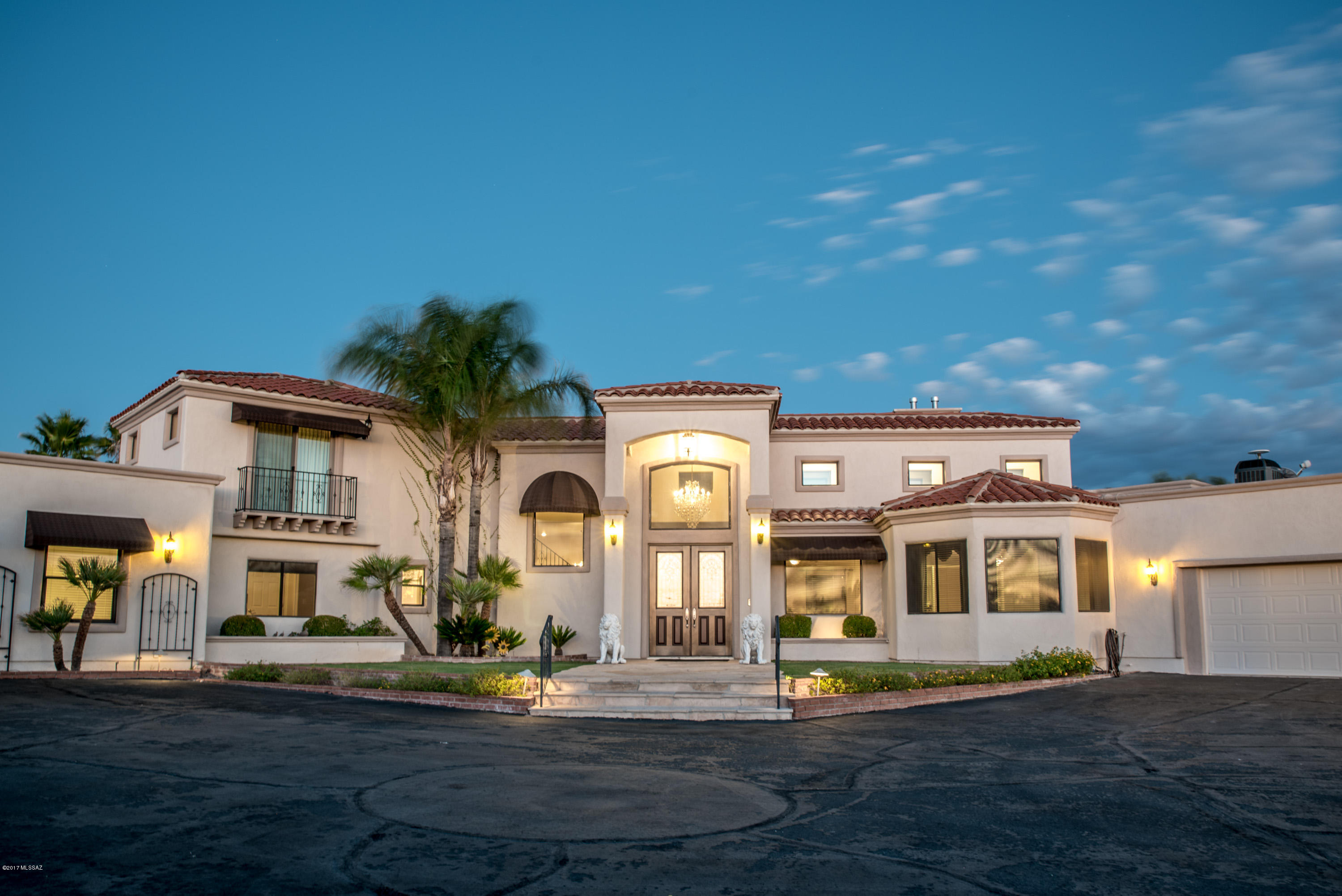 Breathtaking 5038 sqft estate sitting on 4.34 acres of your very own meticulously landscaped private oasis that is irrigated by two private wells! Entertainer's paradise features a wrap around wood beam patio with built in grill, endless mountain views, large Koi Pond with brick walkover bridge, and negative edge pebbletec pool. For the adventurer, this home is close to Saguaro National Monument bike and horse trails. 
This home has been updated throughout and features granite countertops, stainless steel appliances, walk-in pantry, 2 Electronically controlled security gates, massive laundry room, Sundeck and elevated viewing area with spectacular Rincon views, and a garage large enough for 21’ boat with trailer. Come see this completely fenced horse property today!