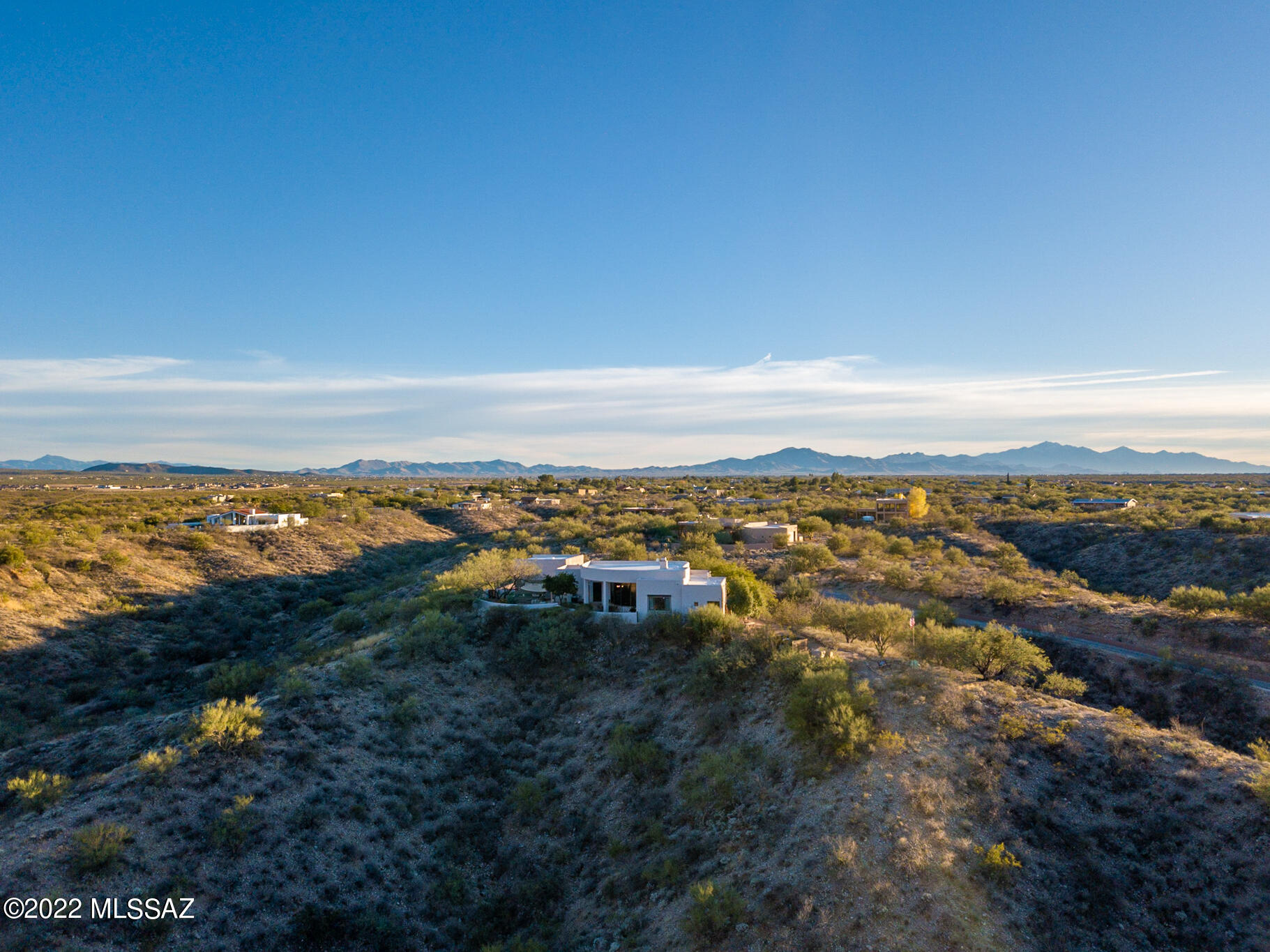 Stunning, panoramic, magnificent. Those are all words that would fall short of describing the views from this top of the mountain custom built and beautifully rennovated home on a more than 3 acre lot. Enjoy cooking from the timelessly remodeled, true chefs kitchen with top of the line appliances, spanning granite counters, and a flow that your culinary side will love to make magic in. Shinning wood floors span most of the living area under lofty ceilings that are truly complimented by the 11' windows that look over your personal mountain and valley view. The primary suite is spacious & airy, and with a redone luxurious bathroom and double closets you will want for nothing. And with two guest rooms with a beautifully updated jack & jill bathroom there is truly space for your lifes needs. The outdoors is breathtaking and truly has to be seen to be believed with citrus trees and desert plantings that make you feel as if you truly are lounging at a mountain top retreat.  The outdoor cooking area features huge countertops for all your entertaining needs. The covered dining areas under the massive covered patio are perfect for all weather. The three car garage has plenty of space for vehicles, toys, and storage and, finally, the detached craftsmans workshop.  This is a space that holds amenities for any hobby, need, or pastime you could possibly have. From wood working to working on a hobby car or even just making a studio or getaway space from the house, this space has every amenity to be what you want it to be.
   This home embodies the word, 'breathtaking' for these and so many more reasons.  Come see and make this top of the mountain castle your home.