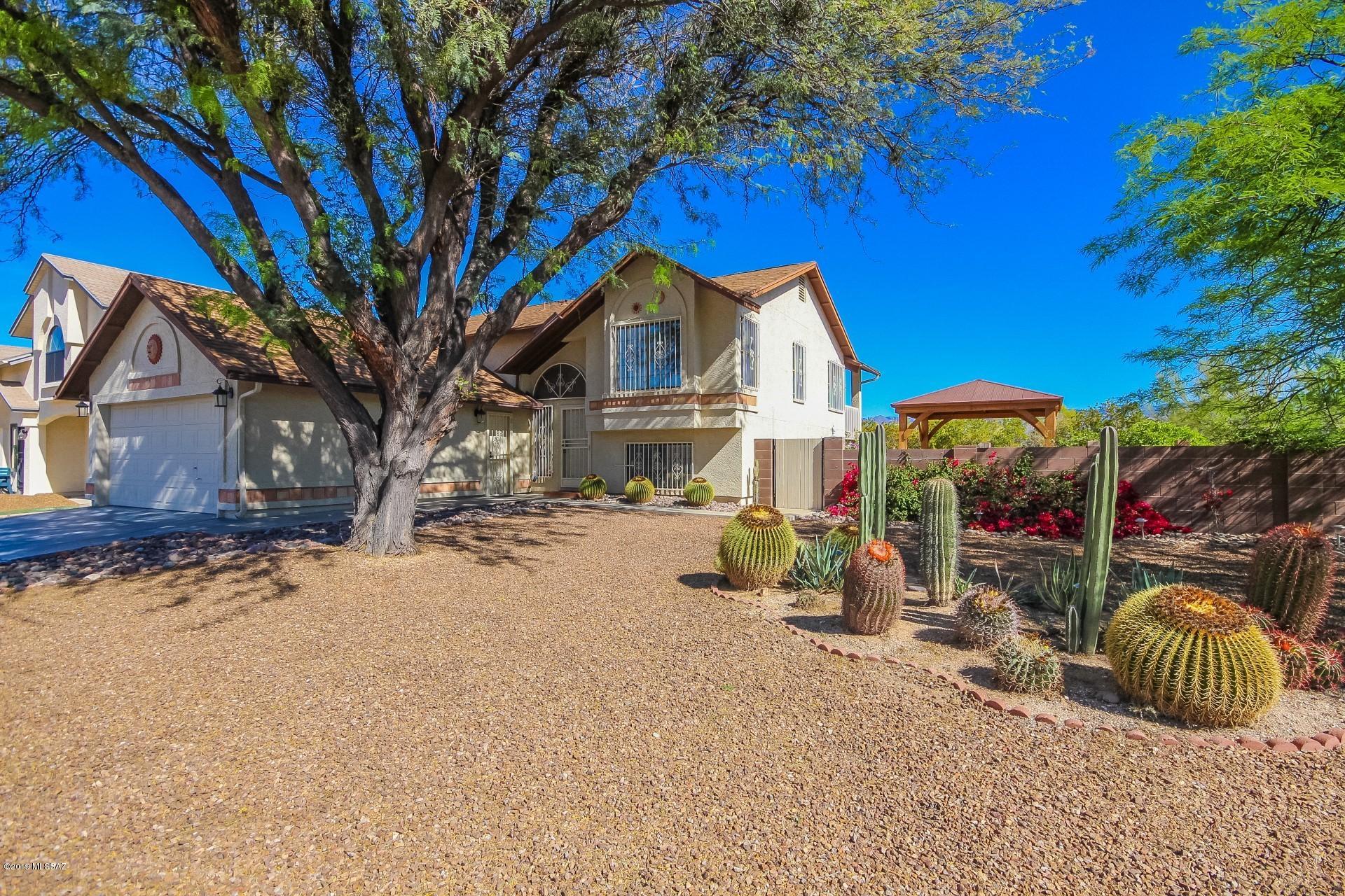This home won't last long!! This is a beautiful east side home located in a desirable community! Everything in this home has been renovated within the past few years so it's like new and move-in ready! Enjoy 3 large bedrooms and a very large den that can be turned into a 4th bedroom. Also enjoy the walk-in closets and the spacious bathrooms with dual vanities and a jetted tub in the master. Not only that but the backyard is an oasis filled with vegetation and citrus and the mountain views from the second story deck are to die for. There is also a shed to give you extra room for storage! This home has one of the biggest lots in the neighborhood and sits in the corner adjacent to a wash! Talk about privacy! Don't miss your chance and schedule a showing today!!
