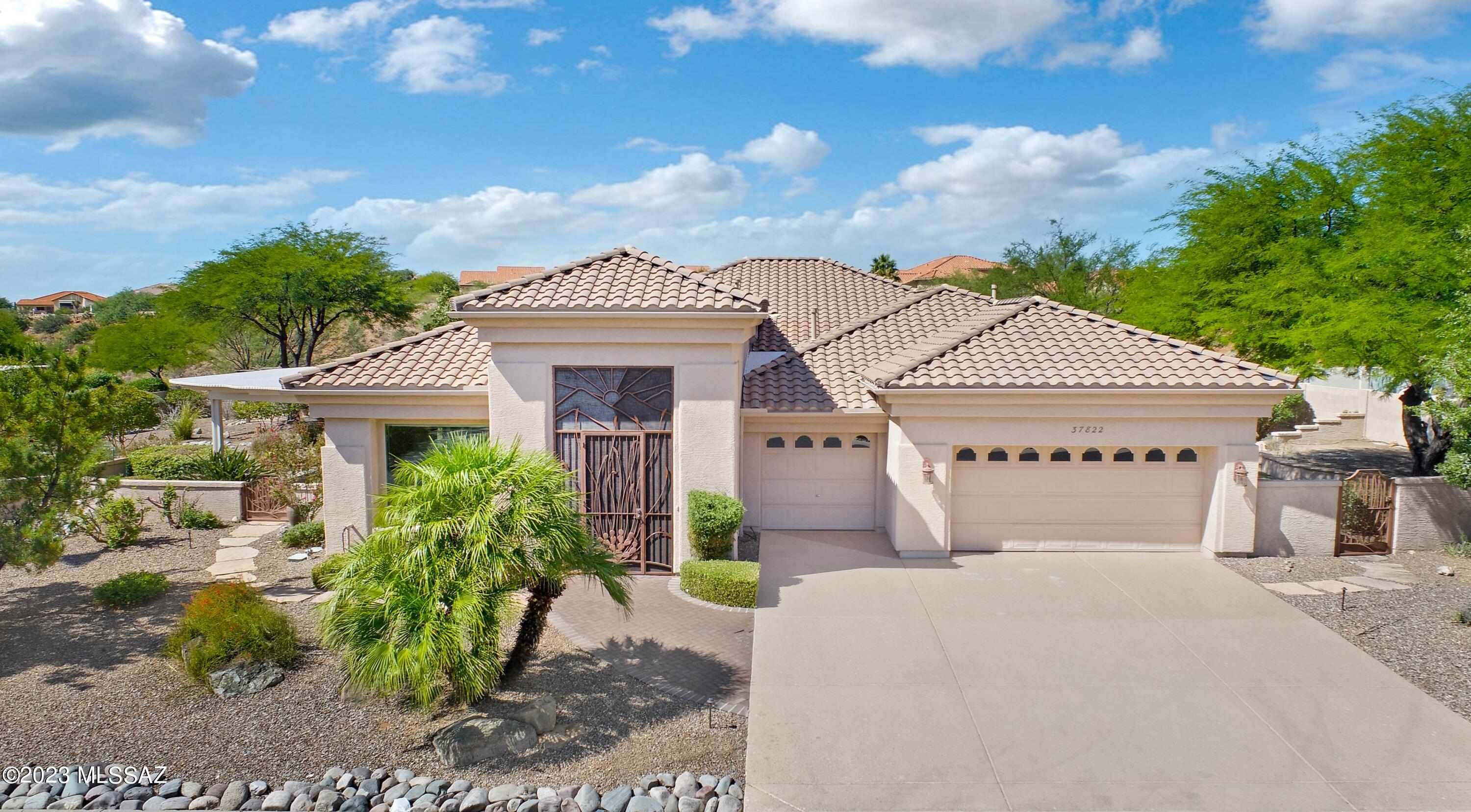 Upgraded Cheyenne with Owned Solar on 1.03 Acre Lot. Great Curb Appeal & Custom Entry Gate. Foyer leads to Den/Office off Living & Dining Area with slider to Patio with Pergola. Wet Bar to entertain & Family Room has wall of windows with Slider to Patio. Kitchen has Granite Counters, Black & Stainless Steel Appliances, Gas Cooktop, custom Backsplash, Dining Area & Desk. Owner's Suite has Bathroom Suite with Walk-in Shower, Soaking Tub & 2 Walk-in Closets. Guest Wing has 2 Bedrooms with closets & Bathroom nearby. Laundry Room has W/D & storage. 3 Car Garage has Utility Sink, newer HVAC's & W/H. Interior freshly painted & tile flooring thru-out. Outdoor Oasis has Covered Paver Patio, extended Pergolas, Built-In BBQ, Fruit Trees, & Raised Garden Bed. Lovely Landscaping & Gated Yard to enjoy!