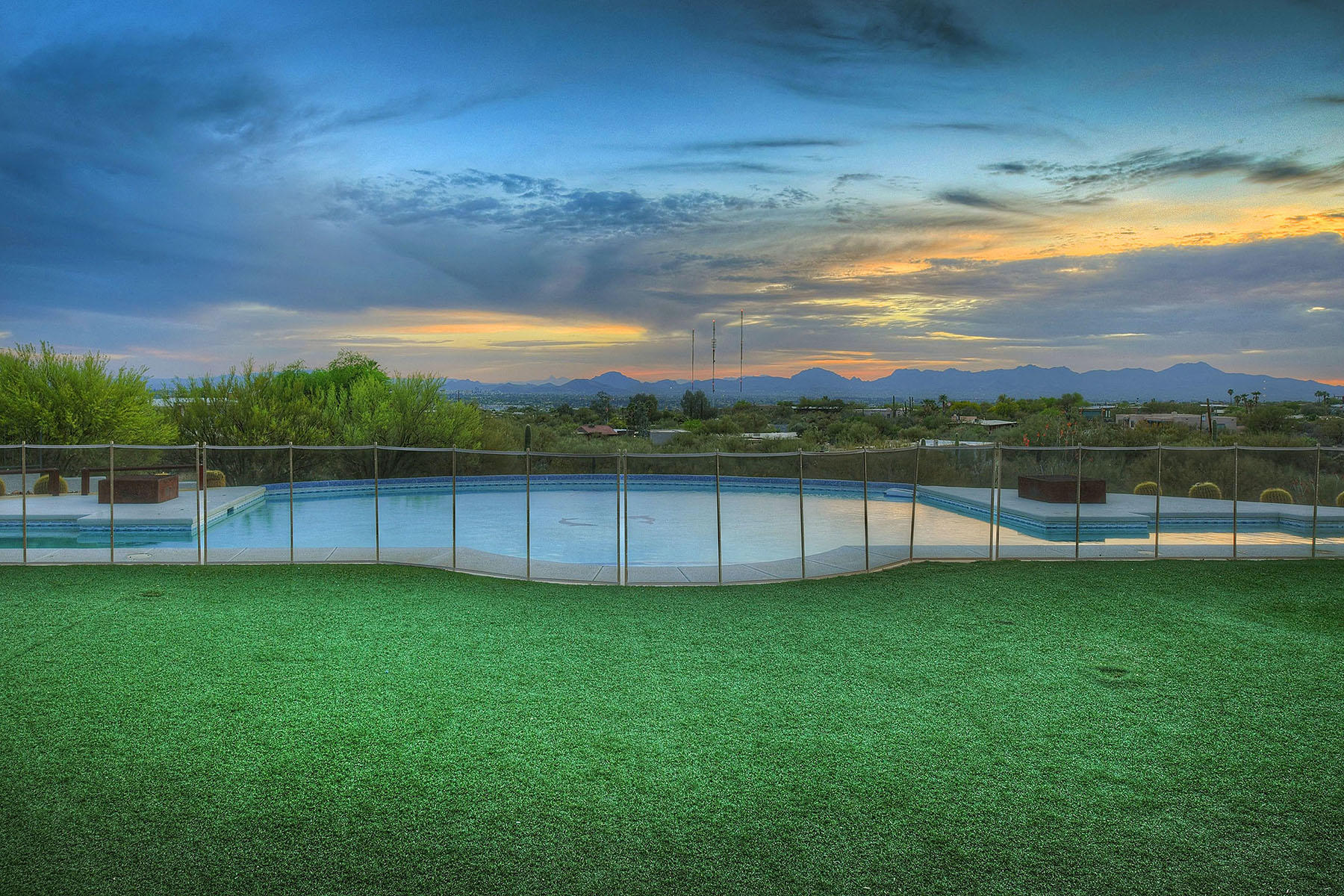 Rare to find a home in the heart of the  Foothills, on almost 3 acres and 
 amazing views!  I love a true great room and this one is anchored by a large fireplace and soaring ceilings.  Glass doors opens to an immense patio, fabulous pool with lap lane, an inviting grassy area, and even a basketball and tennis court. Inside is just as wonderful with a master suite complete with sitting room and even a second master just perfect for guests.   Every bedroom has its own bath.The kitchen is a cooks delight and is assuredly...the heart of the home.  One of the best thing is SOLAR and those  fabulous low electric bills.  New roof, 2 ac's with allergy filtration. So much attention to detail such as replaced windows for exemplorary energy efficiency. Just move in!