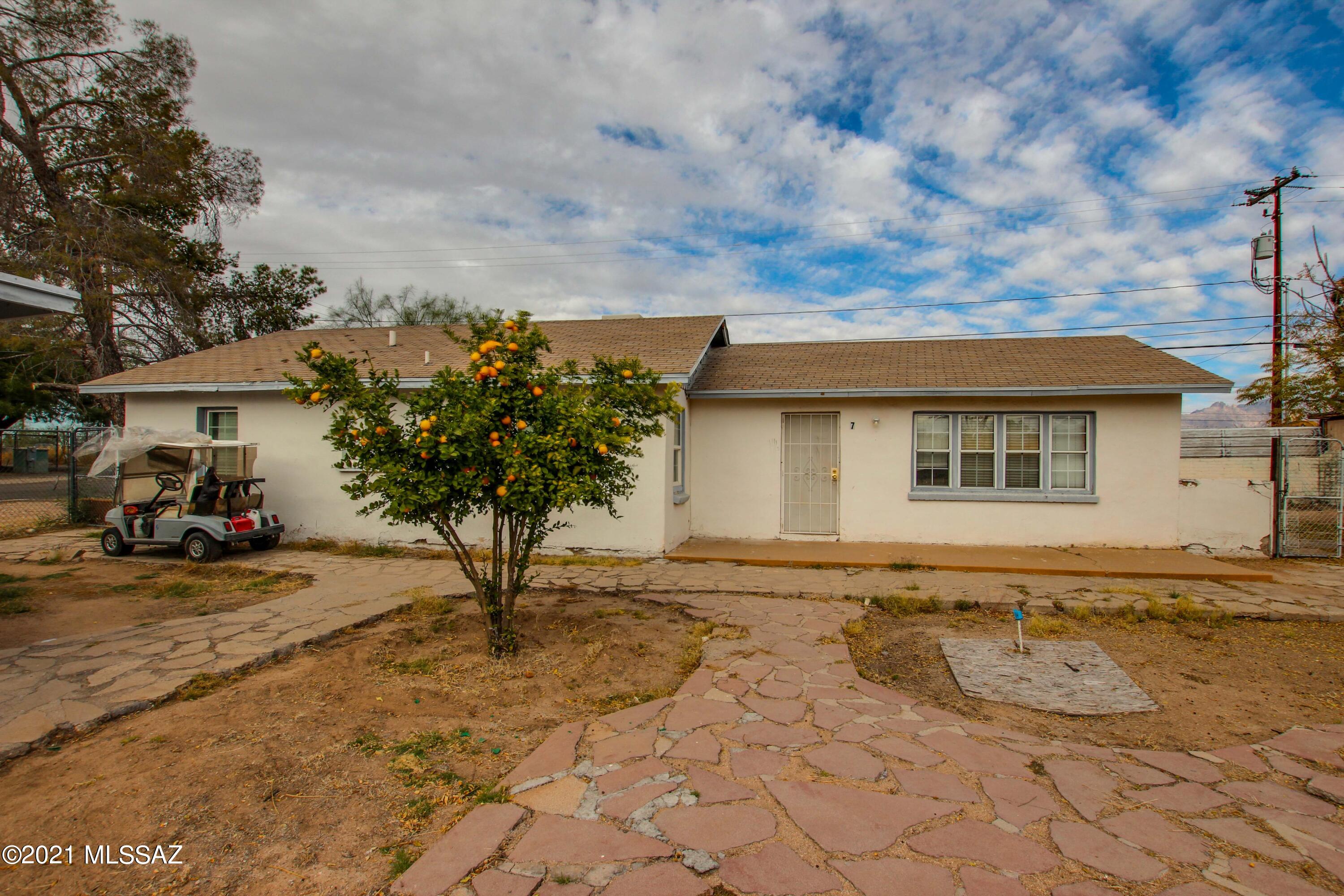 Attention Investors! Centrally located Multi-Family with six 1 BR/1BA units and a 3 BR/1 BA Single Family Home. Fully occupied Unit 1, which is ready for compete remodel. Close to I-10 and Oracle Corridor. Separate Gas and Electric meters, water and sewer paid by Landlord. Gas stoves and Refrigerators convey. Property set up to install community Landry Facility. Two Parcels must be sold together (115-06-1370 and 115-06-1360). Property sold AS IS.