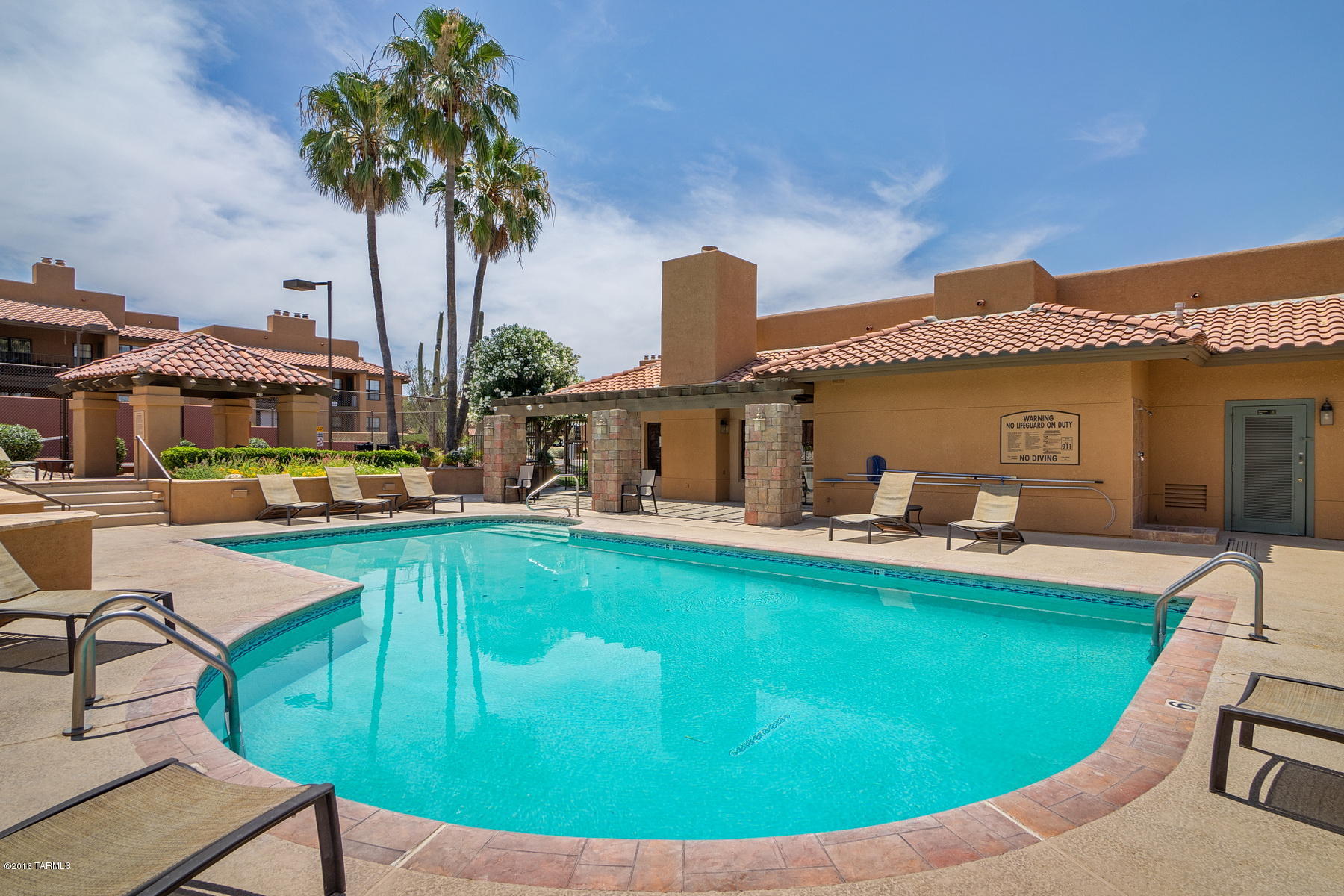 Spacious remodeled 2nd floor condominium with Catalina Mountain views conveniently located just North of La Encantada Mall.  This Northern Tucson property features an open kitchen with granite counters and stainless steel appliances, new carpet installed May 2016, Old Republic Home Warranty policy included, romantic wood burning fireplace, roomy East facing covered patio and resort style HOA Amenities.  The Skyline Village Condos include a heated pool & spa, tennis court, exercise facility, clubhouse, bbq areas and a popular Foothills location near shopping, restaurants and a short drive to The University Of Arizona.