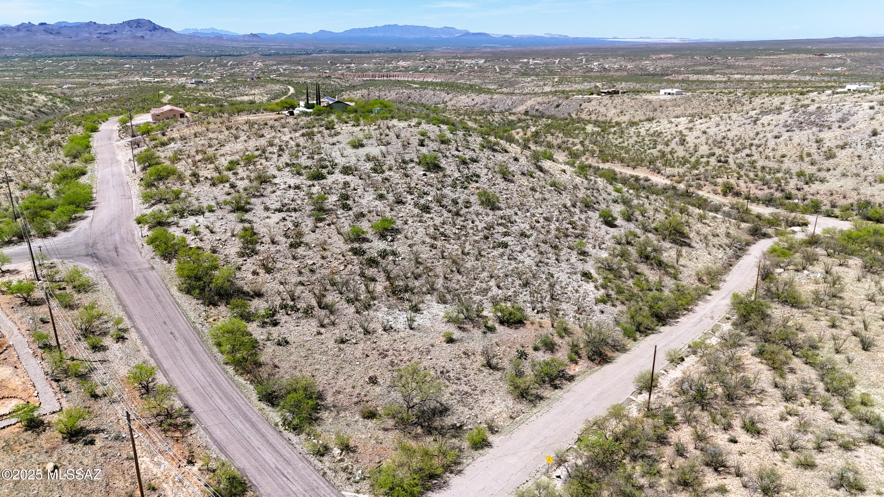 5 lots being sold together.  Best custom home building spot in Rio Rico.  Dramatic 360 degree views.  Paved access about 2.5 miles to I-19.  Electric and Water at the street.  2 of the 5 lots had a percolation test and passed.  Terrific hilltop lots for one large custom home of 5 building lots.