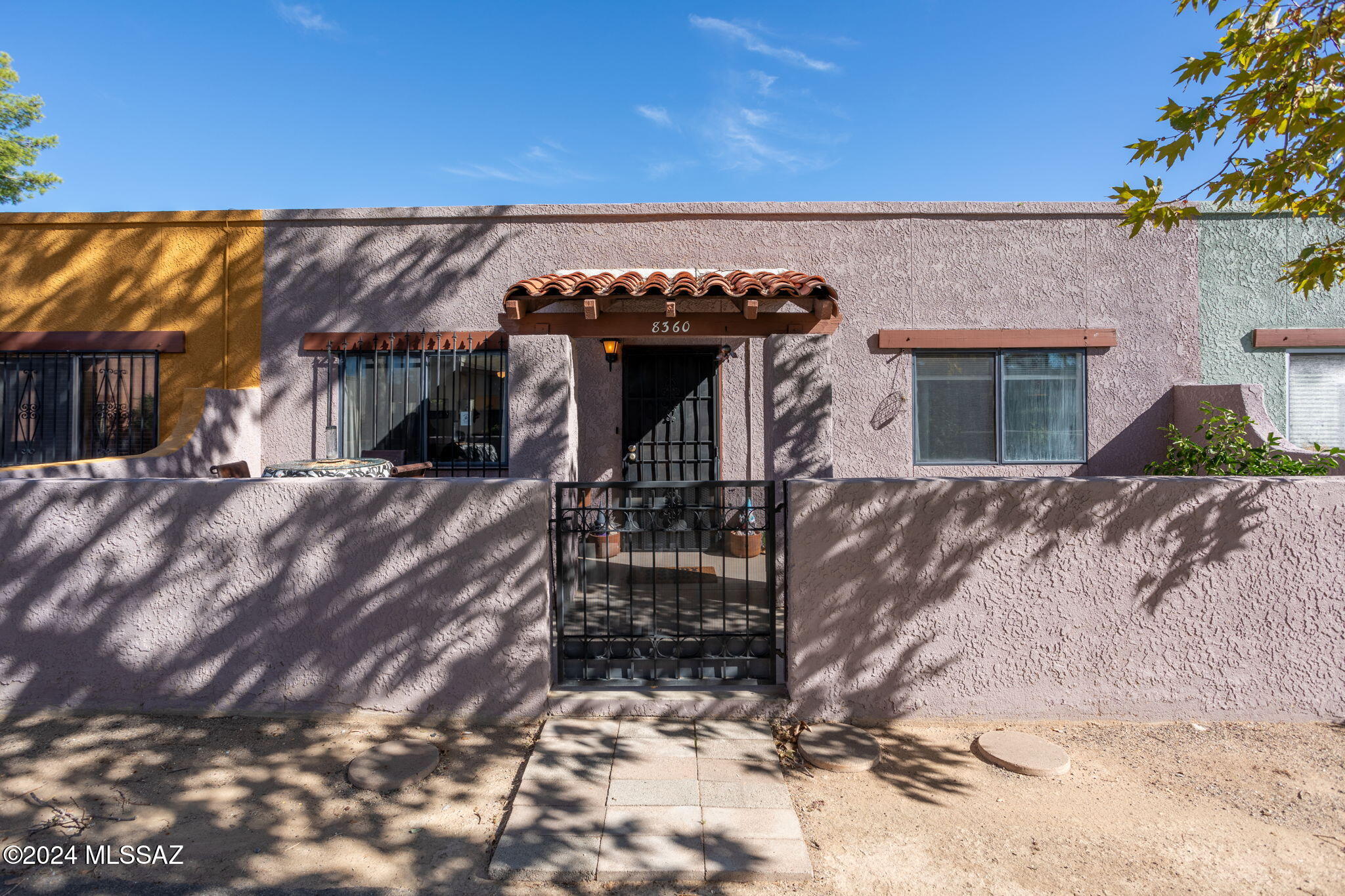 Conveniently located just across the street from the beautiful Tucson Loop, just minutes from everything, while still feeling just a little more out of the way, this gorgeous home is perfect for a stater home, downsized home, or just a low maintenance snowbird home! The roof, HVAC, and water heater have been recently replaced, and this home is ready to go! Enjoy an entertainer's sized living room, spacious bedrooms, and private yard. Just outside the front door is a beautiful grassy common area and community pool, and out back is your conveniently located covered parking spot! This home is the perfect combination of comfortable and convenient, and it's ready for you! Come check it out today!