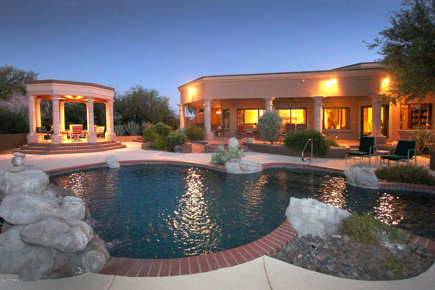 Motivated Seller! Summerlands Estate becomes available! This resort-style paradise on 6.6 acres resides on the east side. Expanded and renovated in 2004, this home shows all the meticulous details that makes this truly a one of a kind home. Hand-forged iron work, murals, canterra stone, granite, marble, hand cut stone, etc. Lush garden and natural foliage and unique artwork and sculptures that add to the resort feeling. Both residences have pools and hot tubs, horse stables and kennels. Guesthouse garage also has steel T-support truss for an engine hoist and 2 car lift stack rack allowing 8 car parking. Endless panoramic mountain views and access to miles of riding trails. Plenty of room for a sports or tennis court. This is truly a spectacular and uncompromising estate!