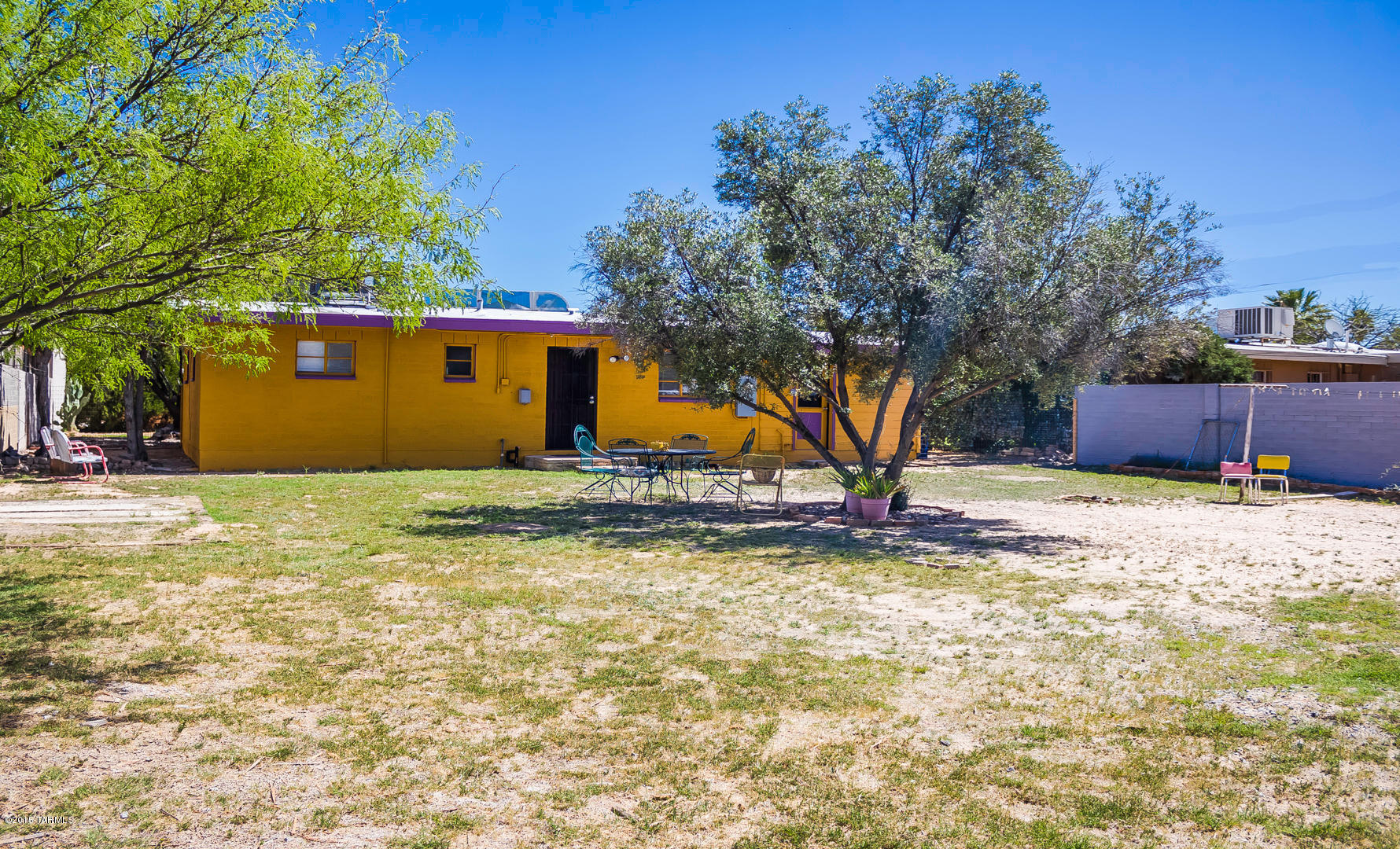 DELIGHTFUL, CHARMING REMODELED HOME. LIGHT & BRIGHT, TILED FLOORS THROUGHOUT, KITCHEN WITH CUSTOM WOOD CABINETS, NEARLY NEW AC/HEATER PUMP, NEWLY REDONE ROOF, ENCLOSED CARPORT, LOTS OF STORAGE SPACE, LARGE ENCLOSED YARD, SEPARATE LAUNDRY ROOM,CONVENIENT CENTRAL LOCATION. NEAR SHOPPING, U OF A, RESTAURANTS,ENTERTAINMENT AND PARKS.