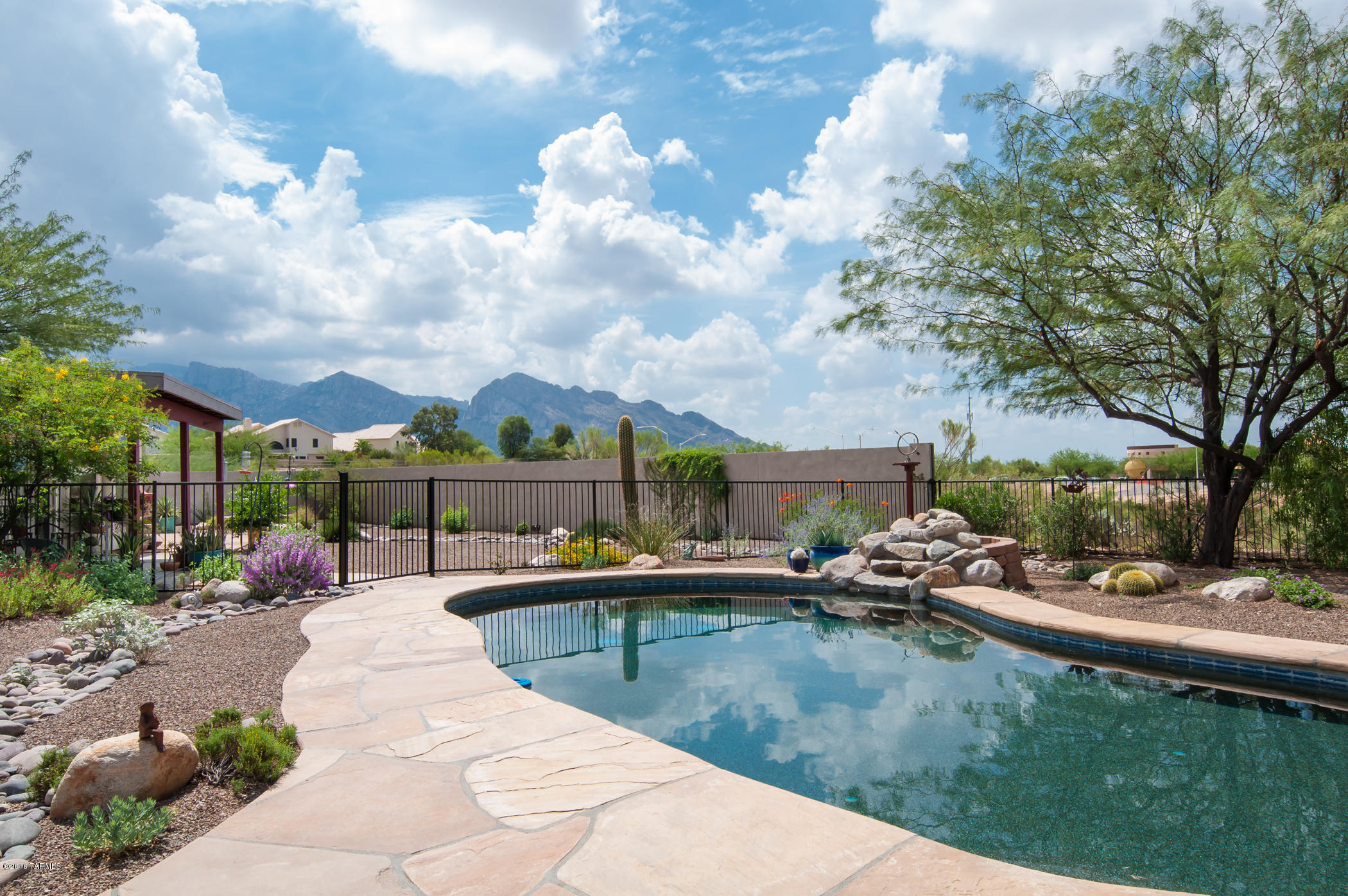 Canada Hills living at its Best! Remodeled in 2014~ Nicely updated! Beautiful tiled floors, plush carpet in bedrooms, custom tiled baths w/updated fixtures, Granite kitchen counters, and Cantera stone surround at gas fireplace in Great room. Wonderful floor plan with separate 3 bedrooms + Den/3 baths- has options to be used as 2 master suites! Private & large 1/3 acre fenced lot has Mountain views, El Conquistador Golf course nearby, Outdoor patio kitchen w/Beehive fireplace, built-in BBQ w/seating, Pebble-Tec pool has waterfall & Hot Tub. Monthly Pool service & annual landscape maintenance in lease. Don't Disturb tenants; Non-Smoking & Pet on approval, 2-day notice & occupancy 6/1/17. For sale or lease whichever comes first will cancel the other. Exceptional place to call home.