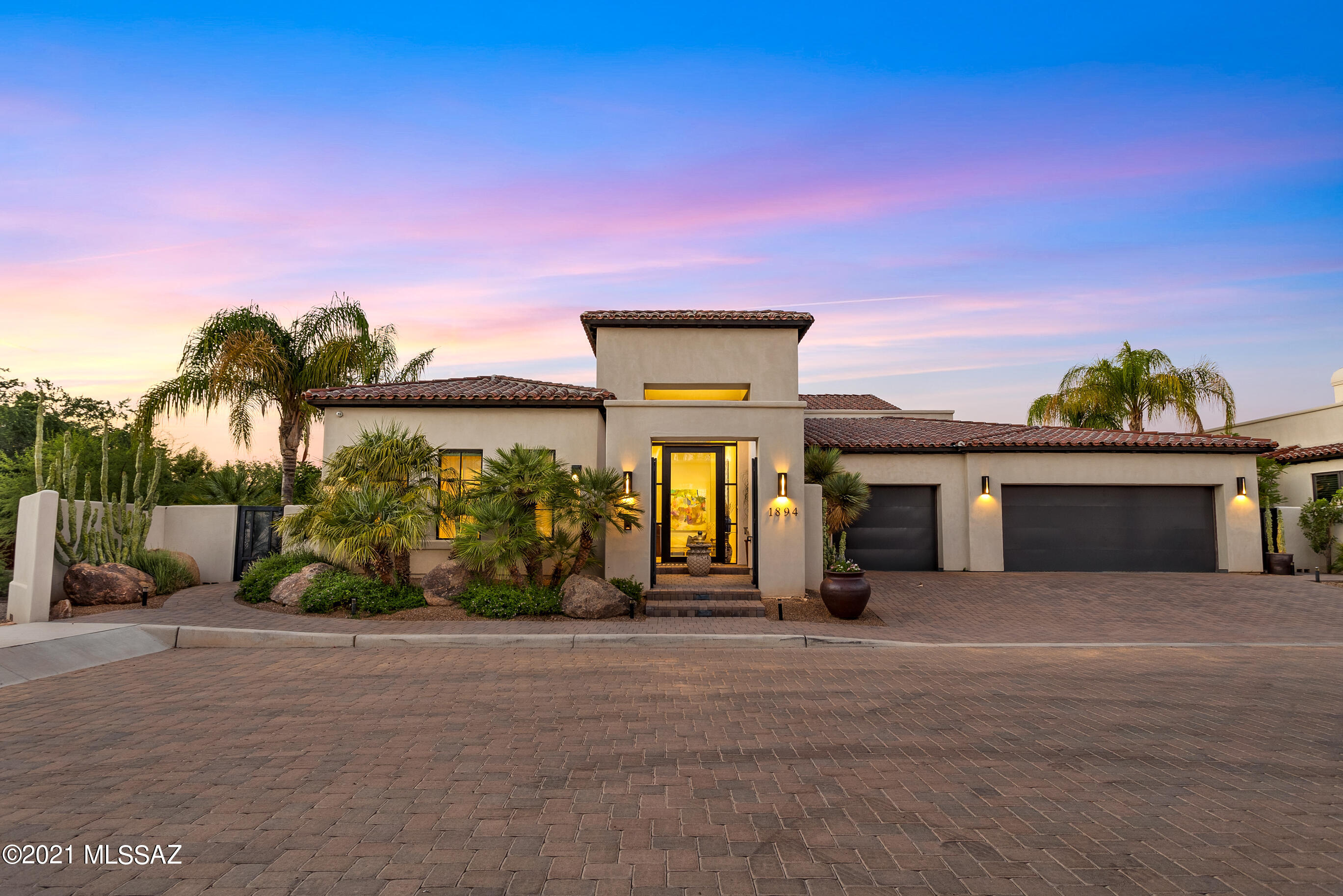 BEST OF THE BEST! Best lot location within the best ''new'' 11 home subdivision, steps to the Arizona Inn. A beautiful Spanish Mission/Contemporary ultra luxury retreat -  the best of our indoor/outdoor lifestyle. The hi-ceilinged Entry Hall/Art Gallery leads to a spacious, bright, airy and open Great Room, a fantastic space with a large living area/fireplace, formal dining area and a kitchen for the most demanding gourmet cook. (There is also an adjoining 2nd kitchen area, completely equipped.) The Great Room opens to large covered patio facing quiet woods and with Catalina Mountain views - BBQ/drop down screens/gas heaters offer year around entertainment space. Master suite/bath/closets - spectacular! Office prepped and could easily be converted to a 3rd BR/BA. Garage/shop heated/cooled.