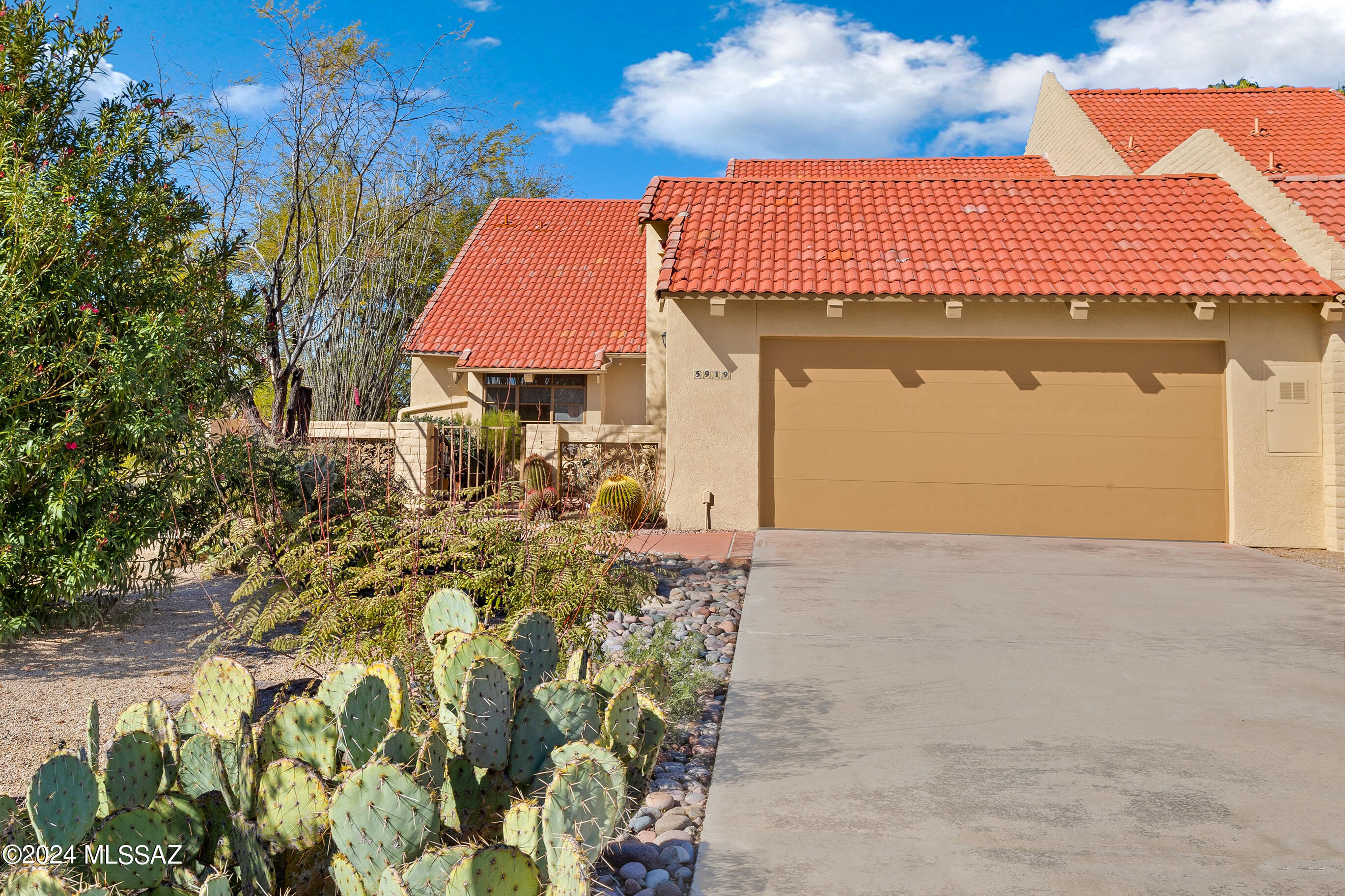 This home embraces you with warmth when you come through the front door. High cathedral wood ceilings & the richness of the saltillo tile floors; beautifully proportioned large rooms. The living room overlooks the  very private patio that backs to desert with Catalina mountain views. Beautiful mountain views also from the large primary bedroom. The neighborhood pool and spa are close by.
This home has been a winter rental at $3500 a month. This is the perfect location w/ easy access to many restaurants in the area and close by La Encantada.
Sellers have never used the alarm system and do not know if it works or not. Pull down ladder in master closet leads to large area that is great for storage.