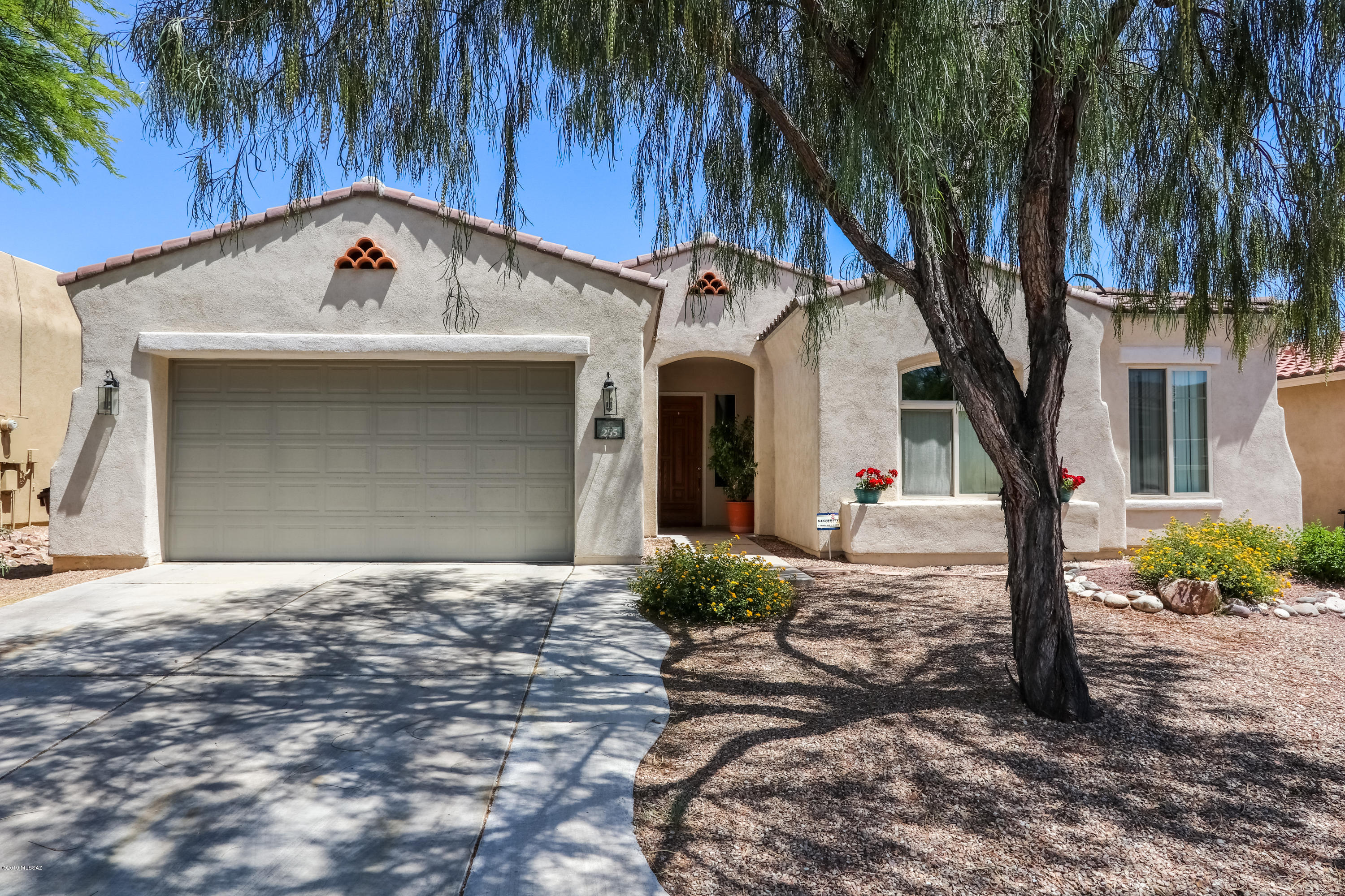 Come enjoy this house with rental income built in! Tenants in place until 2020 and ready to welcome their new owner. Set in Rancho Sahuarita with amazing family-friendly amenities with splash pads, parks, lake, clubhouse and much more. Inside freshly painted within the last year, open floor plan, 3 car garage and landscaped backyard including extended covered patio with built in fire pit. Over sized master bedroom with huge walk-in closet.