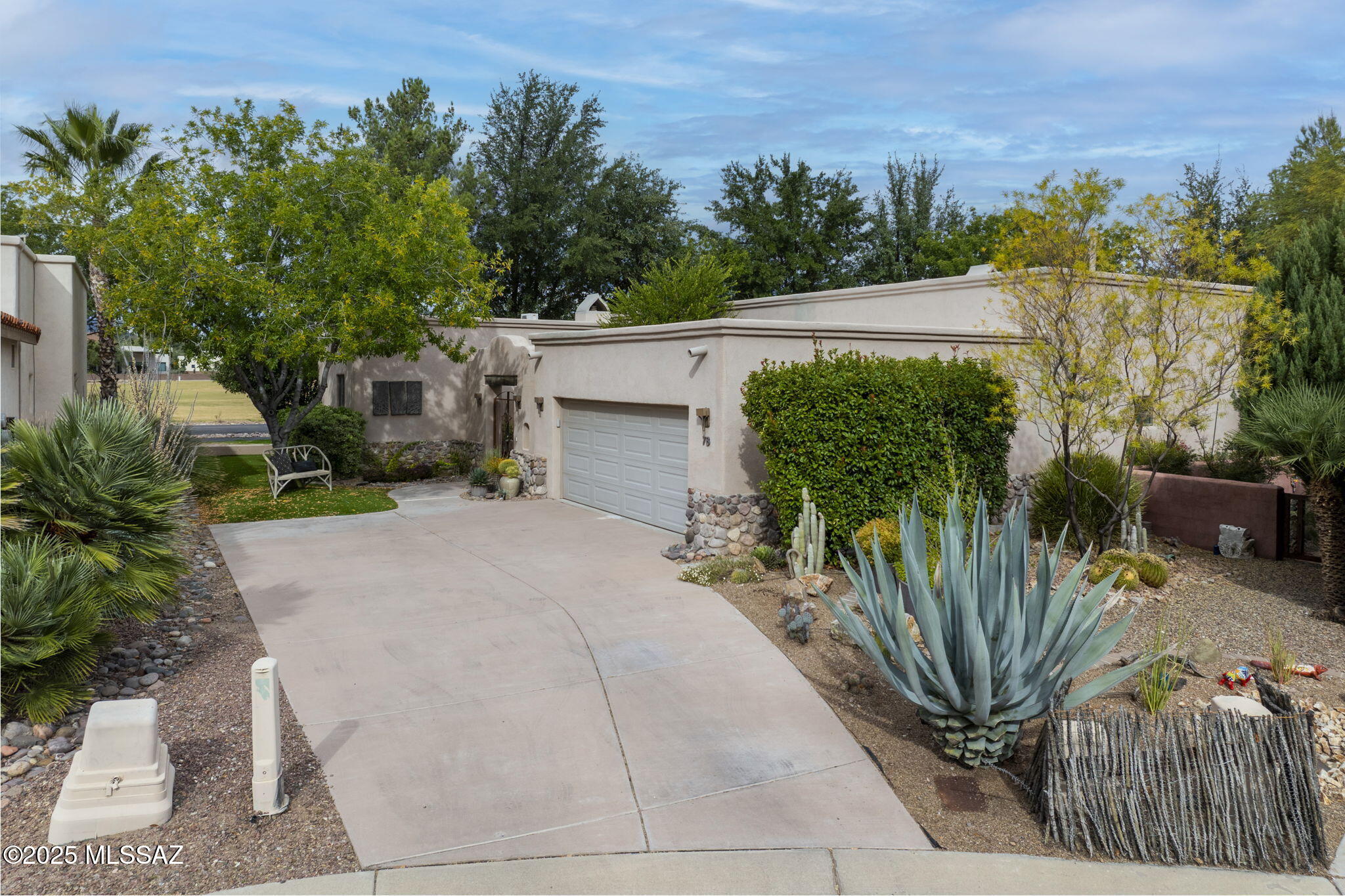 Every detail in this spectacular residence has been thoughtfully curated for comfort, convenience, and refined living. Enjoy views of the Tubac Golf Resort along with the Santa Rita and Tumacacori Mountains. Sophisticated architectural elements blend indoor and outdoor spaces, creating a seamless connection to the home's exceptional landscaping. A beautiful gated front courtyard with fireplace! Covered rear terraces showcase panoramic vistas with access from both the primary and guest bedrooms. Interior highlights include tile flooring, exposed beams, vaulted ceilings, and impressive fireplaces in both the living room and the casita.The stunning gourmet kitchen features custom cabinetry, artisan tile backsplash, spacious island, and upgraded appliances!