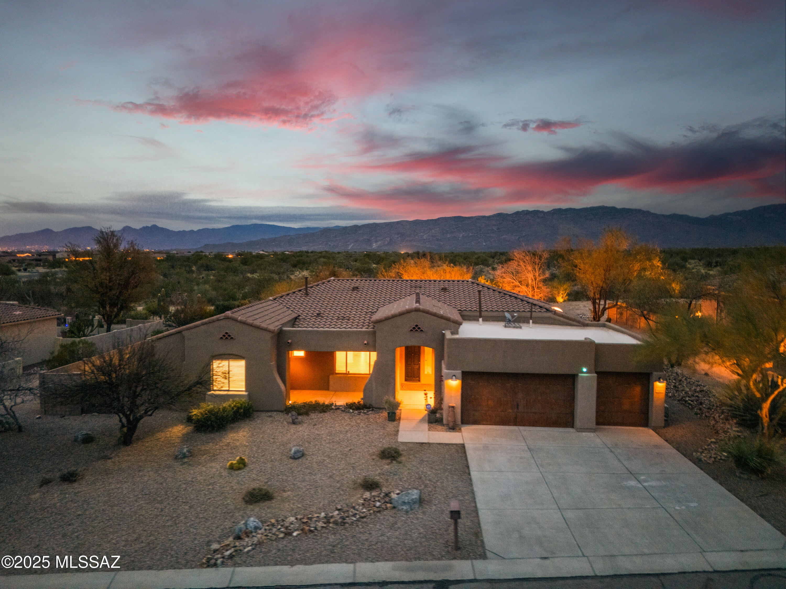 Roof replaced 2024, HVAC replaced 2023, New carpet in living room and Primary Suite in 2022, New Carpet in remaining 3 bedrooms Nov/2024. This meticulously maintained & tastefully updated residence epitomizes elegance & comfort. 4 spacious bedrooms, including 2 primary suites, & 3 full bathrooms, all thoughtfully designed to provide privacy & luxury. The updated kitchen boasts high-end appliances, ample storage, & exotic granite countertops, creating a culinary haven for both casual meals & grand gatherings. The main primary bathroom has been elegantly remodeled with modern fixtures, luxurious finishes, & spa-like amenities, offering a serene retreat within your home. The open floor plan seamlessly connects living areas, featuring soaring ceilings & abundant natural light, fostering an inviting atmosphere for guests. Step outside to the expansive backyard sanctuary, complete with a sparkling pool including an attached waterfall spa, fully enclosed dog run, built in grilling area beside the large, covered patio, and endless possibilities. A spacious 3-car garage provides convenience for multiple vehicles or recreational equipment & features lovely epoxy floors. Abundant storage solutions are integrated throughout the home, ensuring a clutter-free living environment. Situated in the picturesque community of Vail, this home combines luxury living with the tranquility of AZ's natural beauty. Experience the perfect blend of sophistication & comfort in a residence that truly has it all. Don't miss the opportunity to make this exceptional property your own. Reach out today to schedule a private tour & discover the unparalleled lifestyle that awaits you!