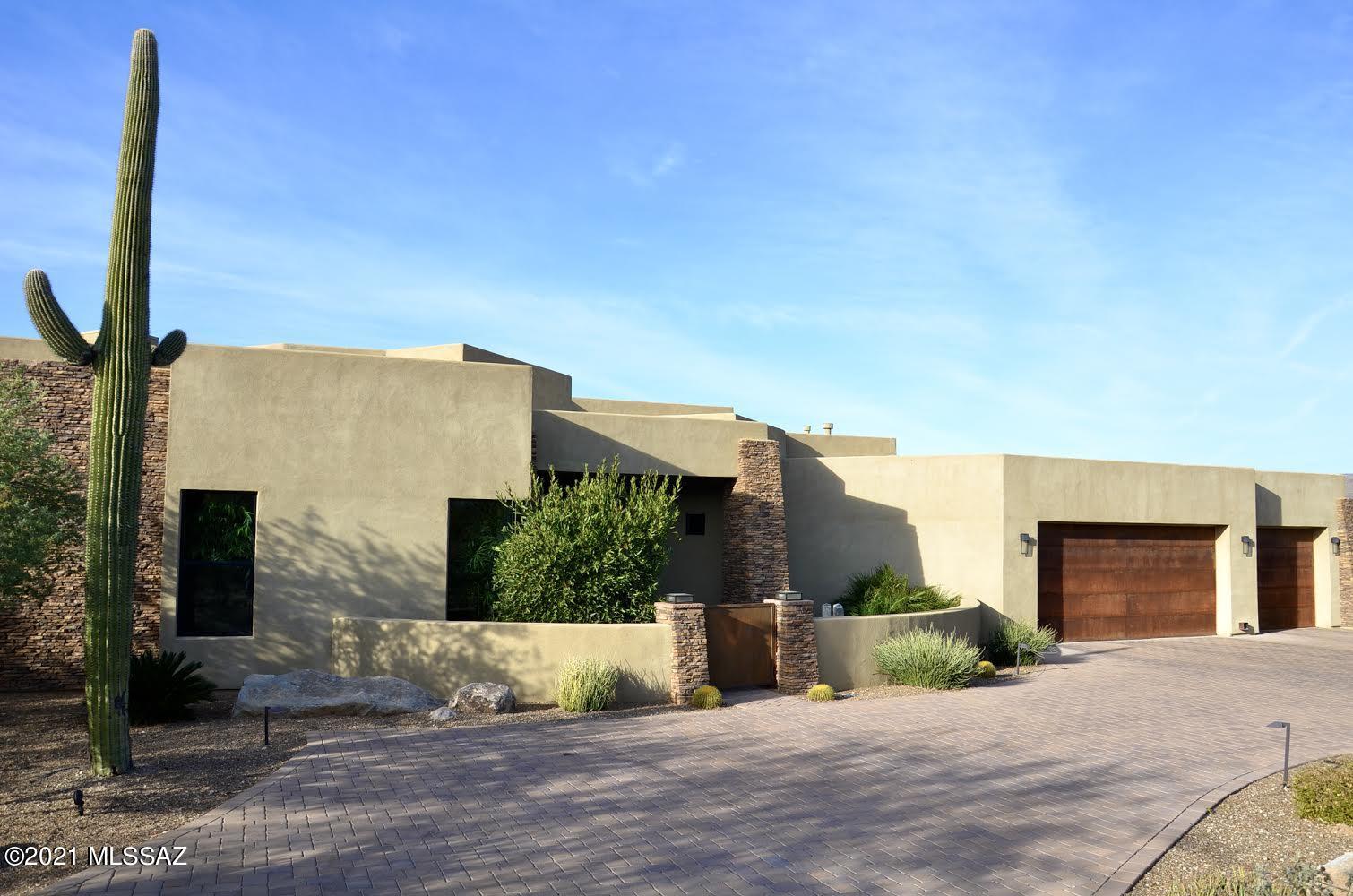 Modern contemporary on private 1.24 acre lot in the highly sought after exclusive Stone Canyon Golf Club. This stunning 4 bedroom, 4 1/2 bath home features solar for minimum electric bills, bathrooms in each bedroom, walk in closets in each room, a fabulous office and private location.  The resort-like pool, surrounded by travertine, offers a fire pit, huge patio for entertaining, lounge ledge, hot tub with mountain views, and solar.  Travertine floors, stacked stone fireplace, stainless, granite, central vacuum, wood floors in workout room, secure dog patio, and split floor plan make it the perfect home for friends and family. The large oversized garage is perfect for 3 cars plus storage. All in the exclusive Stone Canyon.