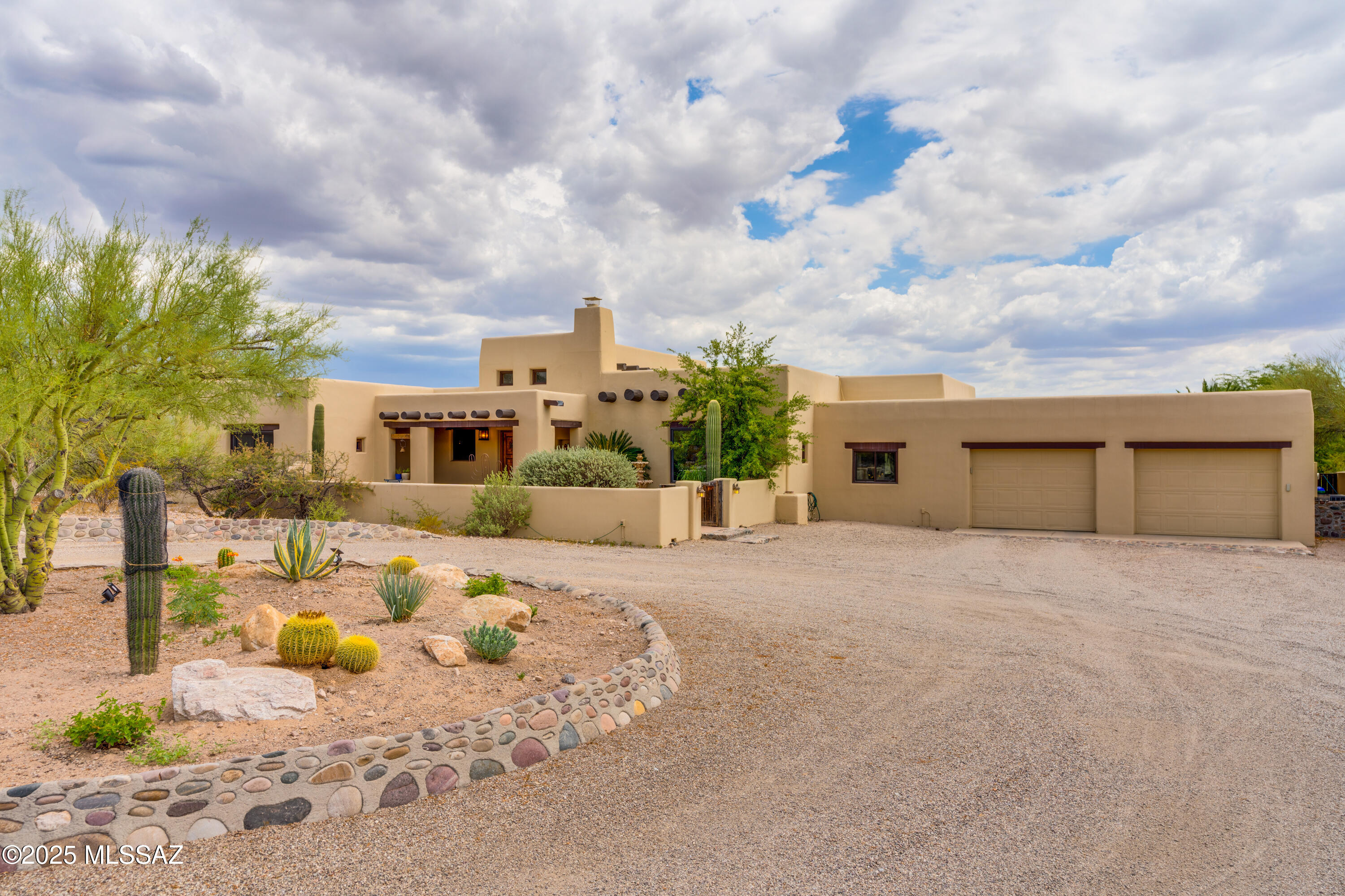 Step into this meticulously maintained double wall constructed adobe home. Upon entering you will pass through the tranquil courtyard and front covered patio where you can sit and absorb the north facing mountain views. As you step inside you will be greeted by the dramatic gallery foyer with 20' ceilings and beaming natural light. Throughout the home you will see saltillo tile flooring, rustic exposed beams and cedar ceilings. This home has high end one of a kind design from the well known ''Dorado Design'' including custom cabinetry,  throughout. The great room opens up into an oversized dining area, huge living room with a beehive fireplace and a chef's dream kitchen. The kitchen is equipped with a large island that offers an eat-in breakfast bar, custom cabinets, six burner Wolf gas cooktop that looks out over the backyard sunset city views. The copper sink, sub zero built-in fridge, built-in Viking oven, built-in microwave and custom tile surround make the design of this kitchen pop with character. Off the kitchen is a sunny Arizona room great for relaxing, an office space or just enjoying the beautiful backyard views.
Inside the primary suite you will find an oversized space with french doors leading out to the spa and backyard oasis. The primary bathroom offers a walk in shower, large walk in closet, and slate top vanity. Walk outside to the resort-like backyard with an oversized pool for those hot sunny Arizona days or enjoy the custom gas fire pit for those chilly nights. The pool has a dual waterfall feature, custom tile surround and deck space for all your outdoor furniture and entertainment. Sit and relax in the custom designed spa that includes a 6' deep section for standing if you desire. Included in the backyard oasis is a huge 16' by 26' ramada with ceiling fans, high-end open trusses, and a wood burning fireplace great for entertaining and relaxation. Just below the ramada you will find the private studio casita updated with concrete flooring, a tasteful imperial plaster ceiling, a small kitchenette covered in "red dragon" granite, a custom designed bath with a huge walk-in shower covered in slate tile and an attached garage that has its own driveway or it could be converted to a bedroom if you choose. You don't want to miss this 3.2-acre horse property with already established horse facilities, space for an arena, nearby riding trails, mature established landscape, and PANORAMIC Mountain VIEWS! 
Call for an appointment.