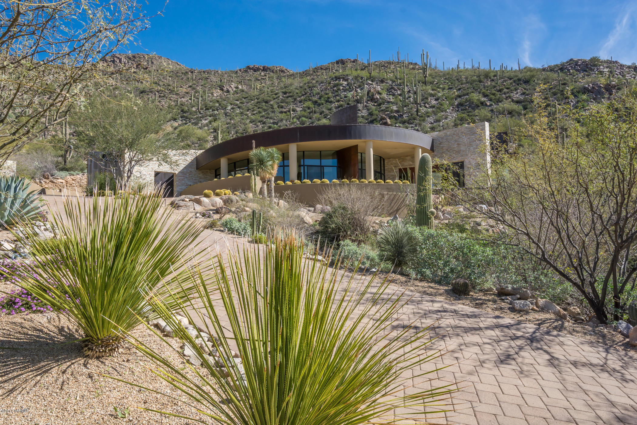 Designed by Kevin Howard and Interiors by Lori Carroll. This property won home of the year in 2006 ! Come enjoy this one of kind hilltop home overlooking the 5th fairway of the Gallery North Course (Escalante-Icon) and the panoramic sunset views. This 2 AC property sits among dramatic rock formations and native saquaros. Sheets of glass capture the Sonoran desert and the floor plan is optimal for a large gathering or just private time. Master Suite and office split by Greatroom/Gourmet Kitchen and Breakfast area. 2 Bedroom with private baths anchor the other side of the home. 1/2 Bath for guests. The negative edge pool and spa are a show stopper. No expense has been sparred. Call for your private showing. You will be overwhelmed !