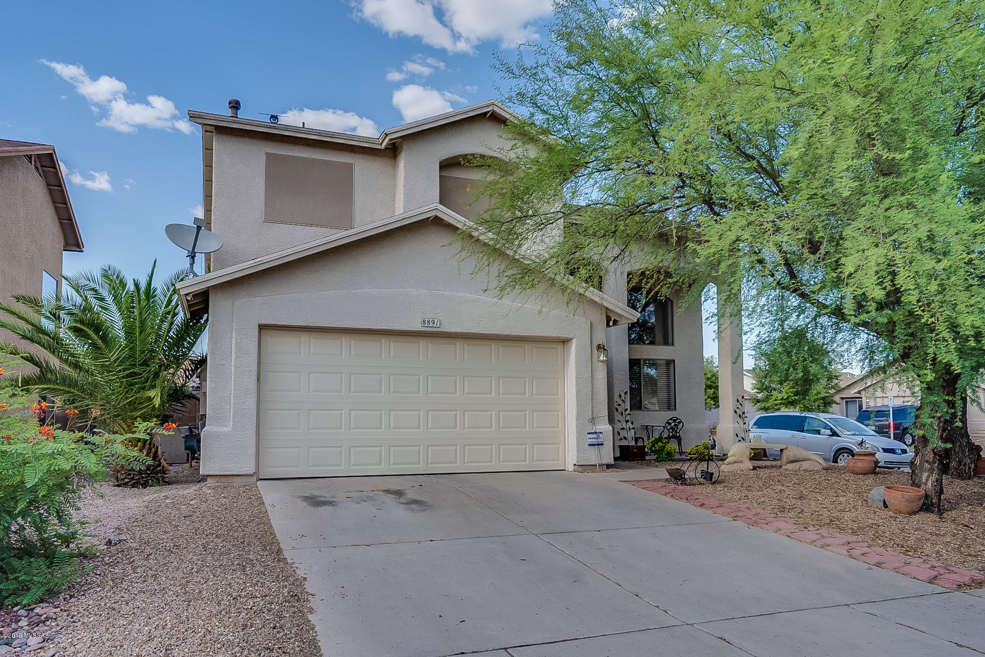 Just reduced with motivated sellers! Great 2 story home that sits on a large corner lot. This 3 Bedroom, 2.5 Bath home is ready for it's new owners located in the coveted Vail School District! High cathedral ceilings with lots of windows. This home has lots of storage and it's own laundry room. Call us for a private tour. Play equipment in backyard is AS IS.