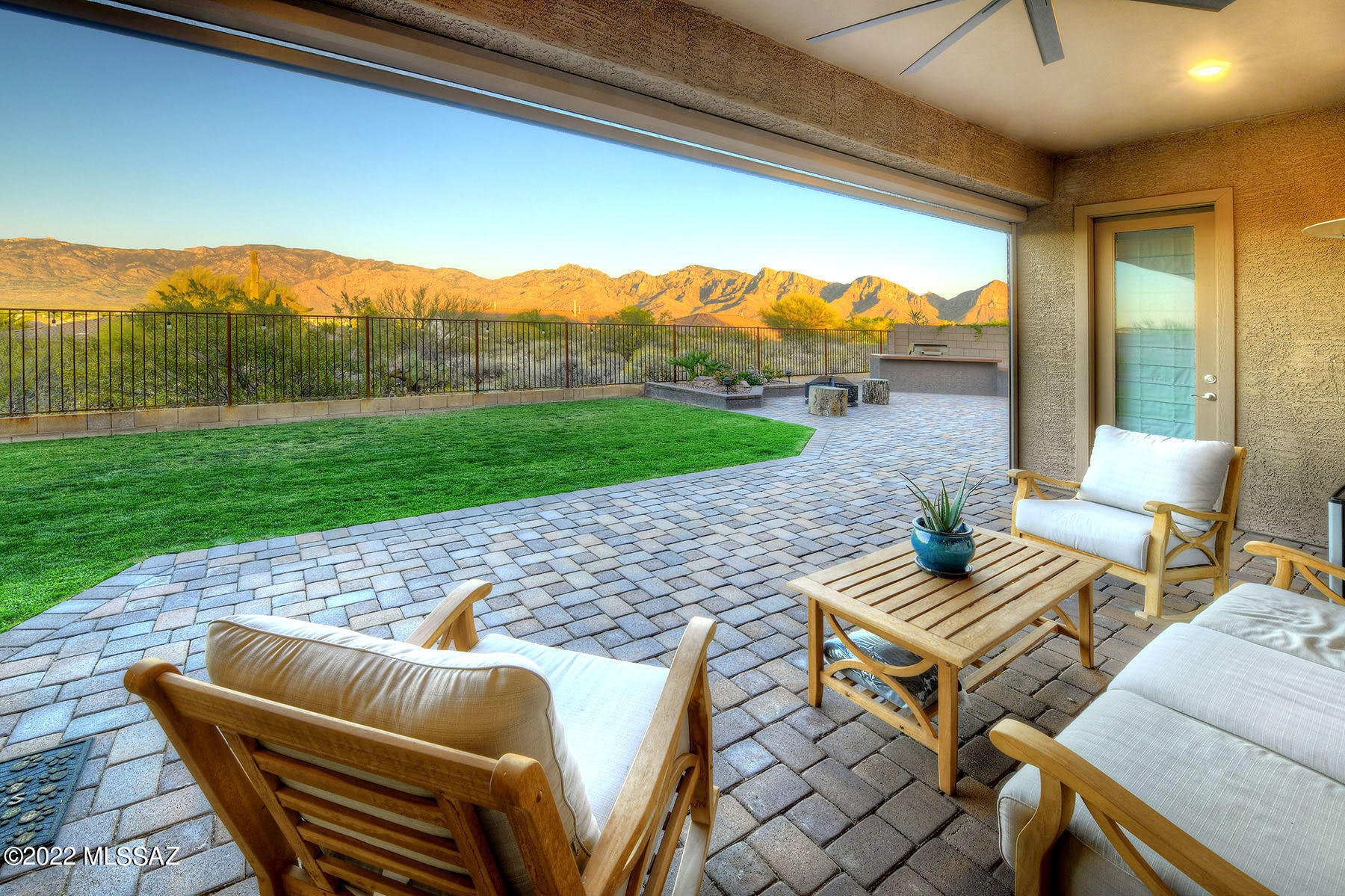 Nestled in the heart of Oro Valley with unobstructed Catalina Mountain views, this 2019 Lennar build is the desirable Revelation Plan that includes a Next Gen Suite! This is a home within a home floor plan and provides an attached private suite that includes a separate entrance, living room, kitchenette, bedroom, bathroom and laundry area. Main 4 bed/3 bath home has an open foyer entry into an expansive great room concept with kitchen and dining areas as the hub of the home. Enjoy the outdoor living from this backyard oasis with built-in BBQ, pizza oven and spectacular mountain views. This home features over $50,000 in builder upgrades. Home is Wi-Fi Certified, Amazon's Echo Show, Sonos, Video Ring Doorbell, Ruckus ICX 12-port Ethernet switch, CAT-6A Wiring to wire3less access point, CAT-5E phone wire to MBR and Kit, and so much more!