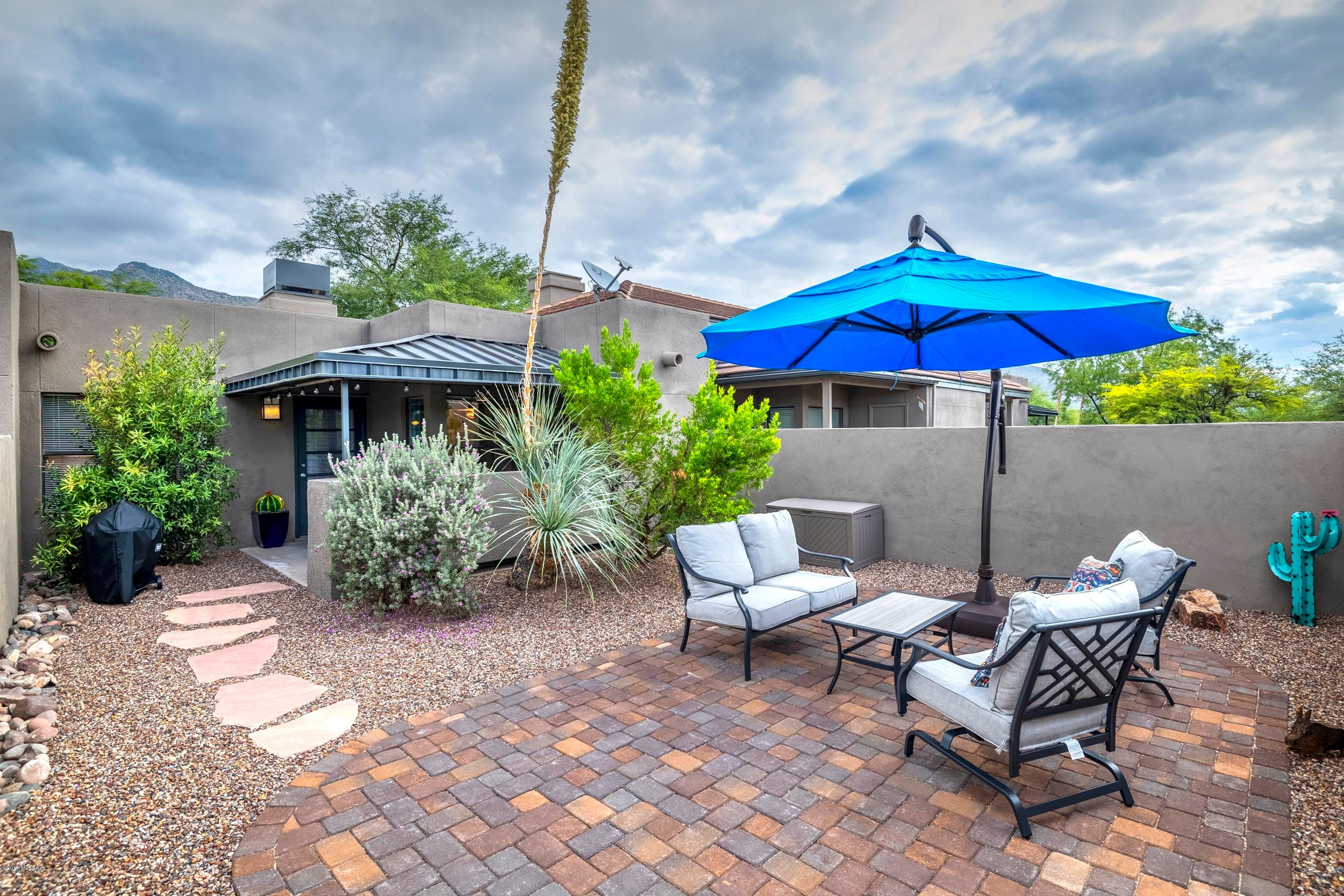 Welcome to Greens at Ventana Canyon!  Charming, fully furnished condo you will love! 2 spacious bedrooms, rich flooring throughout, and kitchen is complete with granite counters & crisp white cabinetry. No upstairs neighbor and spacious backyard! Step out on your private patio to enjoy the outdoors. Resort-like amenities include 3 community pools/ spas and state of the art exercise facilities.