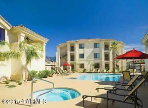 Do not miss out on this opportunity to own in this highly sought after centrally located gated community! Walking distance to fine dining and shopping. Take a walk or bike ride from your own private entrance on the Rillito River walk while enjoying the mountain views! Amenities include: Gated Entry, Fitness Room, Clubhouse, 2 Sparkling pools, and 2 Jacuzzis, covered parking, very large private patio with large storage closet, electric fireplace in living room, 10 minutes from U of A and downtown. Unit being completely remodeled with all new custom cabinets, stainless steel appliances, granite countertops, flooring, lighting fixtures, etc. Rio Del Sol is now FHA approved. Get in with only 3.5% down!