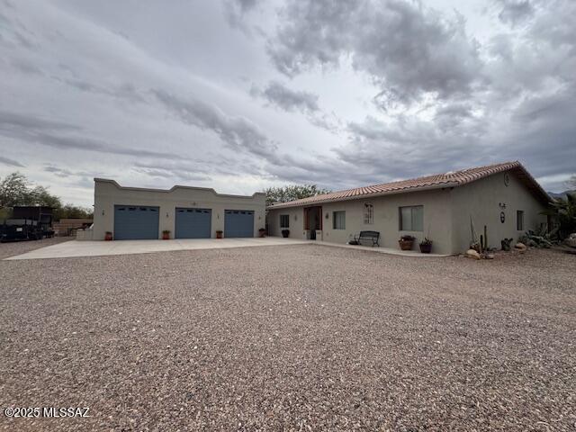 Beautiful home situated on the outskirts of Green Valley on just over 4 acres of horse property with panoramic views. As you enter this inviting home into foyer area that leads into living room with open concept to kitchen, formal dining and Arizona room, great for family or entertaining. Views from kitchen, Arizona room and primary bedroom showcase beautifully landscaped  low care backyard and views of Santa Rita mountain range and elephant head. Primary suite that includes walk in closet double vanities with jetted garden tub and separate shower. One of the four guest bedrooms and bath could easily be used for In-law suite with own entry. Three of the other guest bedrooms and bathroom separate wing for the split floor plan. Looking for a gorgeous home with views, acreage this is it.