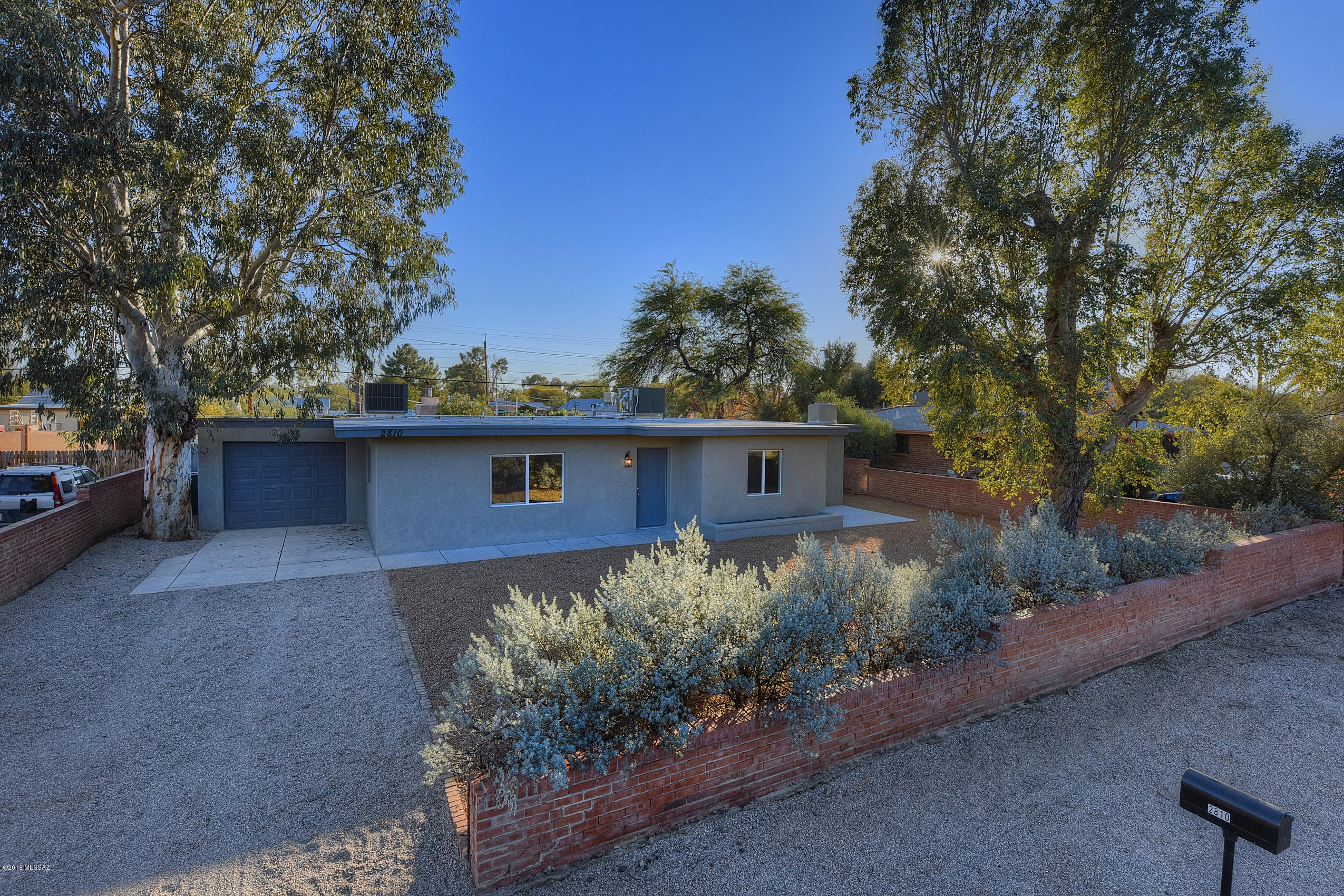 MOVE IN READY!! Remodeled SFR November 2018. This marvelous home is a comfortable 1822 ft². Located minutes from U of A &  restaurants giving you access to fine dining and fun! Highlights include two tone paint inside and outside, ceramic wood looking tile throughout common areas, brand new carpet in bedrooms, brushed nickle light fixtures, brand new dual pane windows. Kitchen features dual sink, brand new cabinets w/beautiful Formica counter tops & New stainless steel appliances (Electric Range Stove, Microwave & Dishwasher will be ordered upon accepted contract.) Bathrooms have brand new vanities, dual flush toilets & tile surround shower w/decorative accents. Home has Brand New (November 2018) AC that blows super cold air! Don't miss out on such a stunning home.