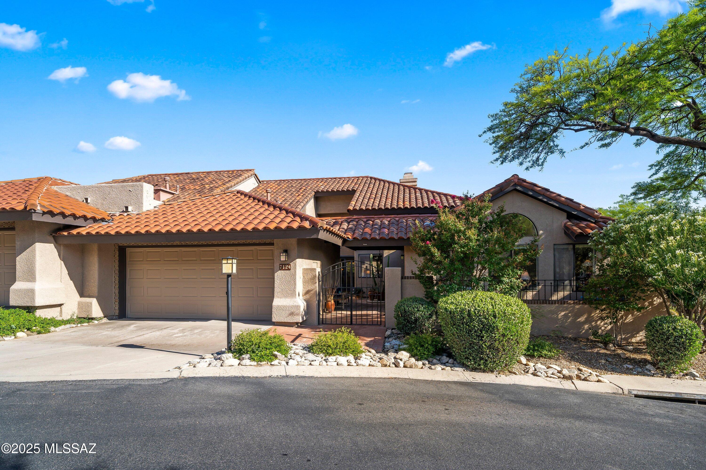 Discover this extraordinary townhouse commanding views of the 7th and 8th fairways, where majestic mountain backdrops enhance the serene setting. Situated on a quiet cul-de-sac in the heart of a premier gated community, this end-unit gem boasts a charming courtyard enhanced by captivating mountain views, further accentuating its curb appeal.

Step outside to enjoy inviting front and back patios, creating a tranquil atmosphere and seamless indoor-outdoor living. Inside, nice remodels throughout elevate the home, with a spacious family room seamlessly connected to a bright breakfast bar—perfect for casual dining or savoring your morning coffee.
Every detail has been meticulously curated in this immaculate townhouse. The open, airy layout, draped in neutral tones, provides a serene and versatile setting. The great room, with its soaring ceilings and distinctive architectural touches, epitomizes refined livingoffering a versatile space ideal for both everyday life and elegant entertaining.