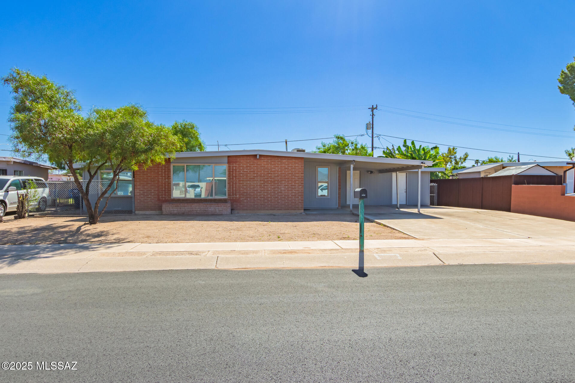 Tastefully updated, this move-in ready home is in the highly desirable neighborhood of Vista Del Prado, located in southeast Tucson, with beautiful north-facing mountain views. The home boasts a spacious layout. The remodeled kitchen and bathrooms feature new countertops and cabinets, grey concrete flooring throughout, new energy-efficient windows, and a new stainless steel appliance package with a gas stove. Additional features include interior and exterior paint, a newer roof, and an air conditioning unit. The bonus room is ideal for an office, dining area, or game room. There is a spacious carport adjacent to a large storage area and the laundry room. Large backyard and NO HOA, making this space the perfect place to call home. Home is close to Davis Monthan Air Force Base and shopping.