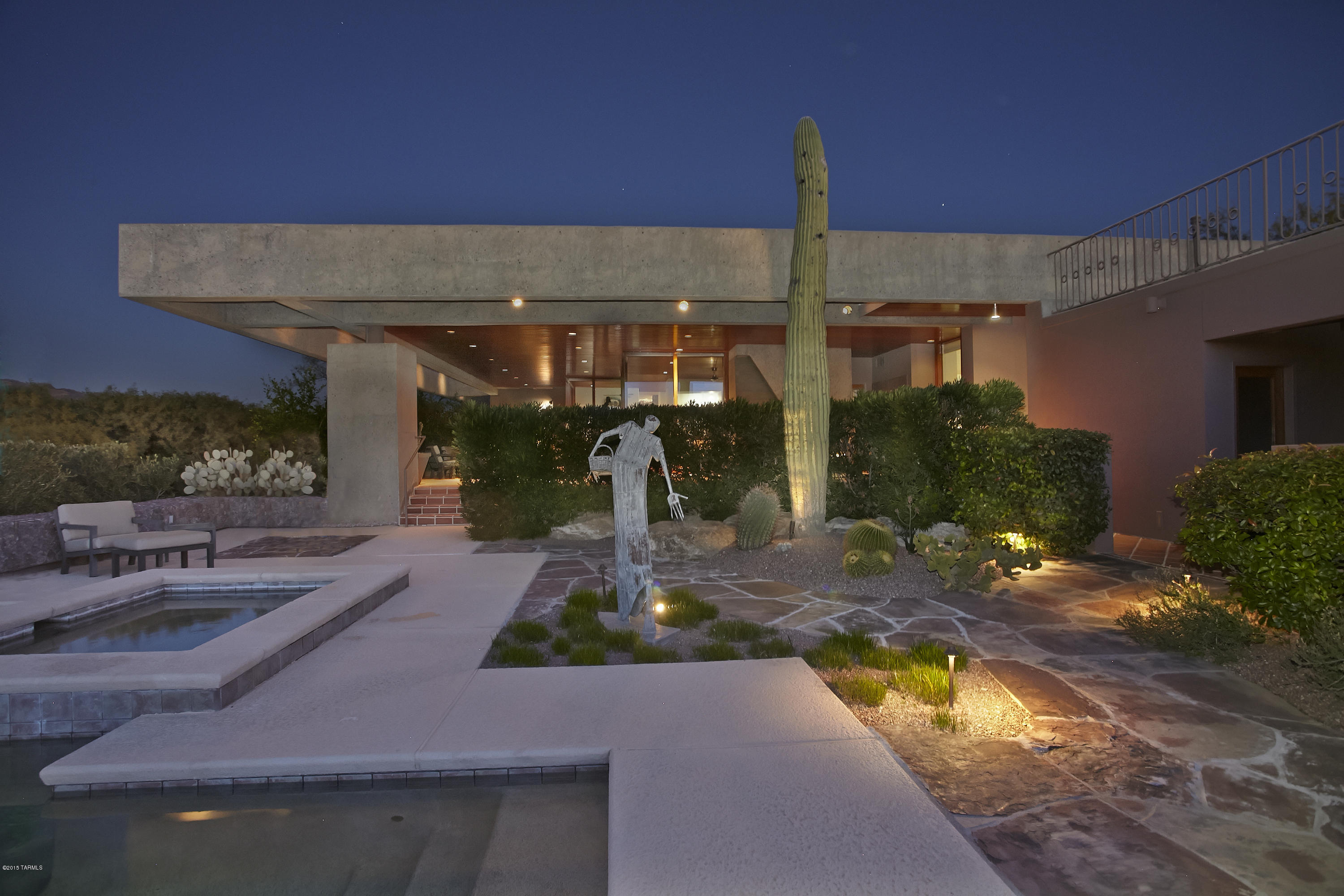 This Spectacular Contemporary is Beautifully Sited to Enjoy all the Natural Pleasures Tucson has to Offer. The Genius of Award Winning Architect Les Wallach Designed and Provides a Perfect Blend of Strength and Beauty. Prime 2 Acre Ridgetop lot with Majestic Catalina Mountain and Sunset Views. The Dramatic Entry Foyer's Hand Quarried Stone Walls with Select Wood Ceiling and Floors Graciously Flow into the Formal and Informal Living Areas. Soaring 80 ft. Aggregate Concrete Beams Frame the Exterior Elevations. Walls of Glass. Expansive Outdoor Entertainment area with Built in BBQ, Fireplace, Pool Bath, Custom Swimming Pool with Spa and Waterfall. Make an Appointment to See this Truly Special and One of a Kind Property.