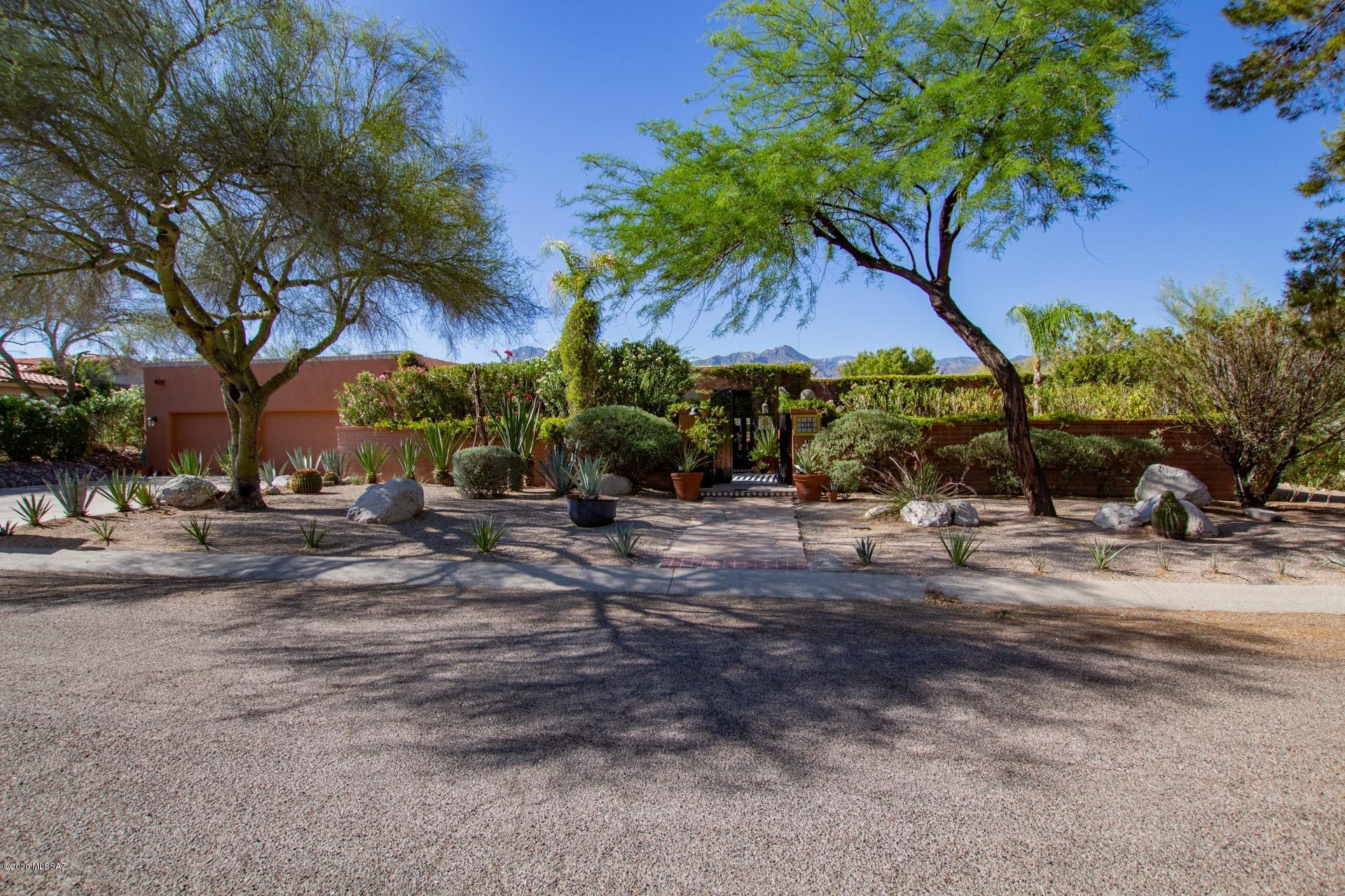 Spanish Territorial Home surrounded by breathtaking Mountain Views in the beautiful Sabino Vista Hills community. Enjoy charming private gated courtyard entry and an entertainer's paradise in the back yard featuring a full outdoor kitchen, bar, fireplace, and secluded side retreat. Front and back yards require low care making it a perfect lock and leave home for winter birds. Master bedroom features massive walk in closet, dual vanity countertops, and walk in shower. Beautiful guest bedrooms feature private bathrooms and closets.  Home can be easily converted to 4 or 5 bedrooms among tons of other possibilities. Lots of room to expand backyard to add a pool. Bonus Office! Seller is motivated!