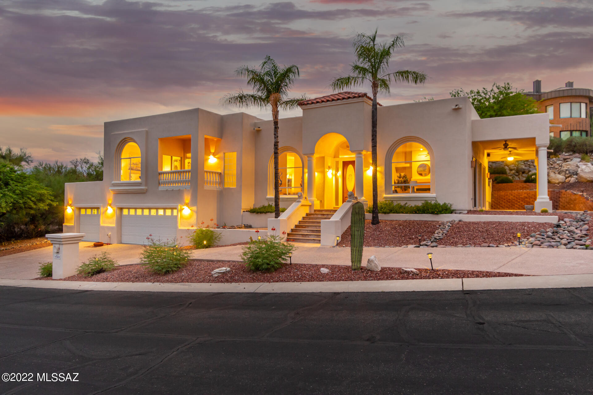Welcome to Ventana Canyon!  Recent updates include new carpet and new appliances! This gorgeous home situated on .29 acres includes dual master suites over a total of 2105 sq. ft. of living space. The great room is open to the kitchen, formal dining area and a beautiful patio through large sliding glass doors, giving amazing views of the Santa Catalina Mountains. The spacious primary suite includes full walk in shower & jetted tub along with a private balcony. Home is complete with 3 car garage and workshop. Owned Solar system keeps your monthly utility payments low. Located in the private gated community of Ventana Entrada with amenities such as tennis, swimming and so much more! Option to add on membership to the private golf & racquet club.