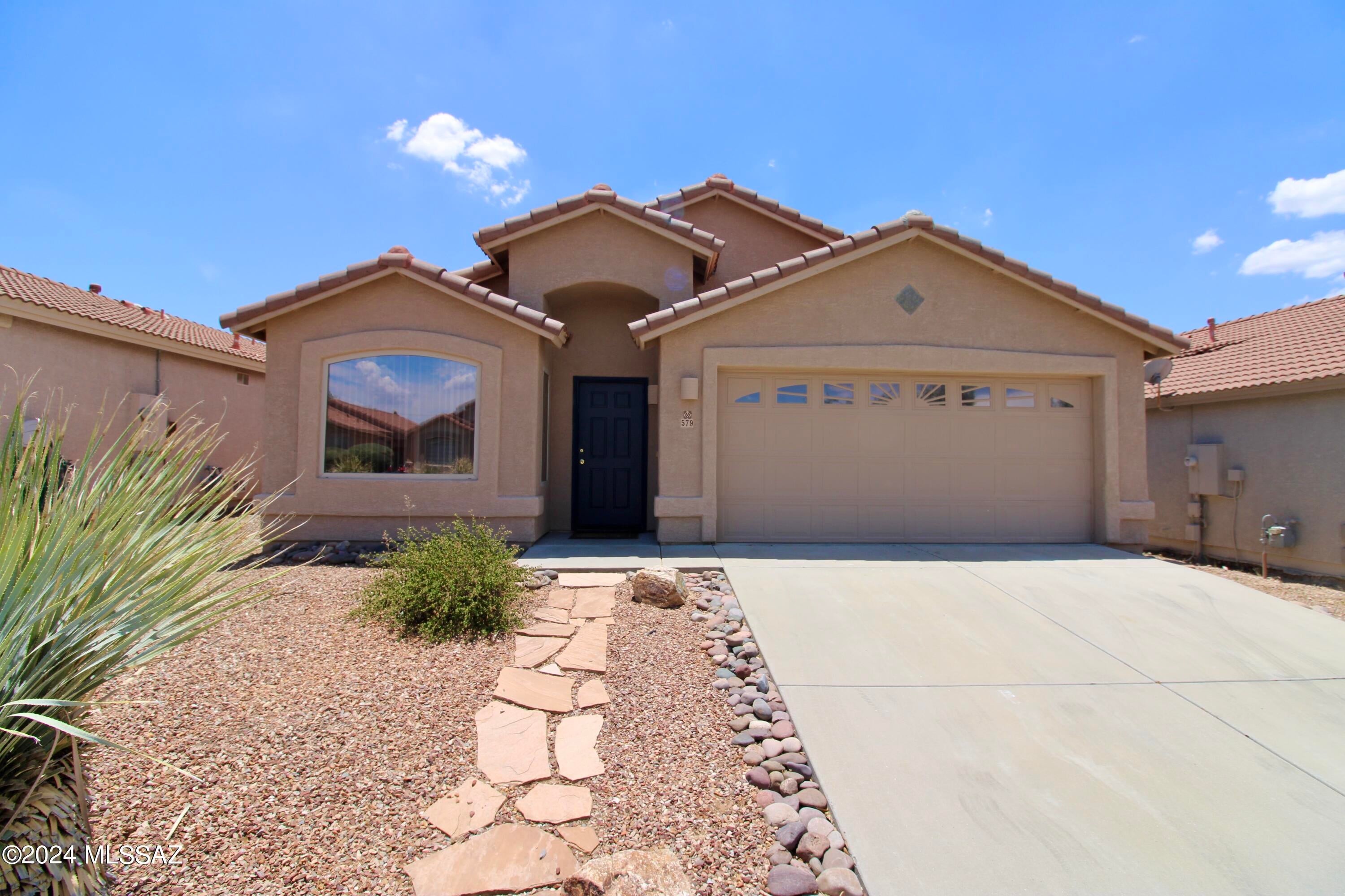 **MOVE IN READY! APPLICATION FEES CREDITED BACK AT MOVE-IN!**
1,873 SQ. FT. 4 bedroom/2 bathroom home. Thoughtful single-story floor plan. Impeccably maintained with porcelain tile throughout and new carpet in bedrooms, newly painted interiors. Spacious open floor plan, great for entertaining! Large living room, large separate family room opens to the kitchen with a large island. Blinds and ceiling fans throughout! Spacious bedrooms! Utility room with washer + dryer included! 2 car garage! Spacious, fully fenced back yard. Professionally landscaped front yard has incredible curb appeal. Convenient Tucson location; close to groceries, hospitals, walking trails and more!