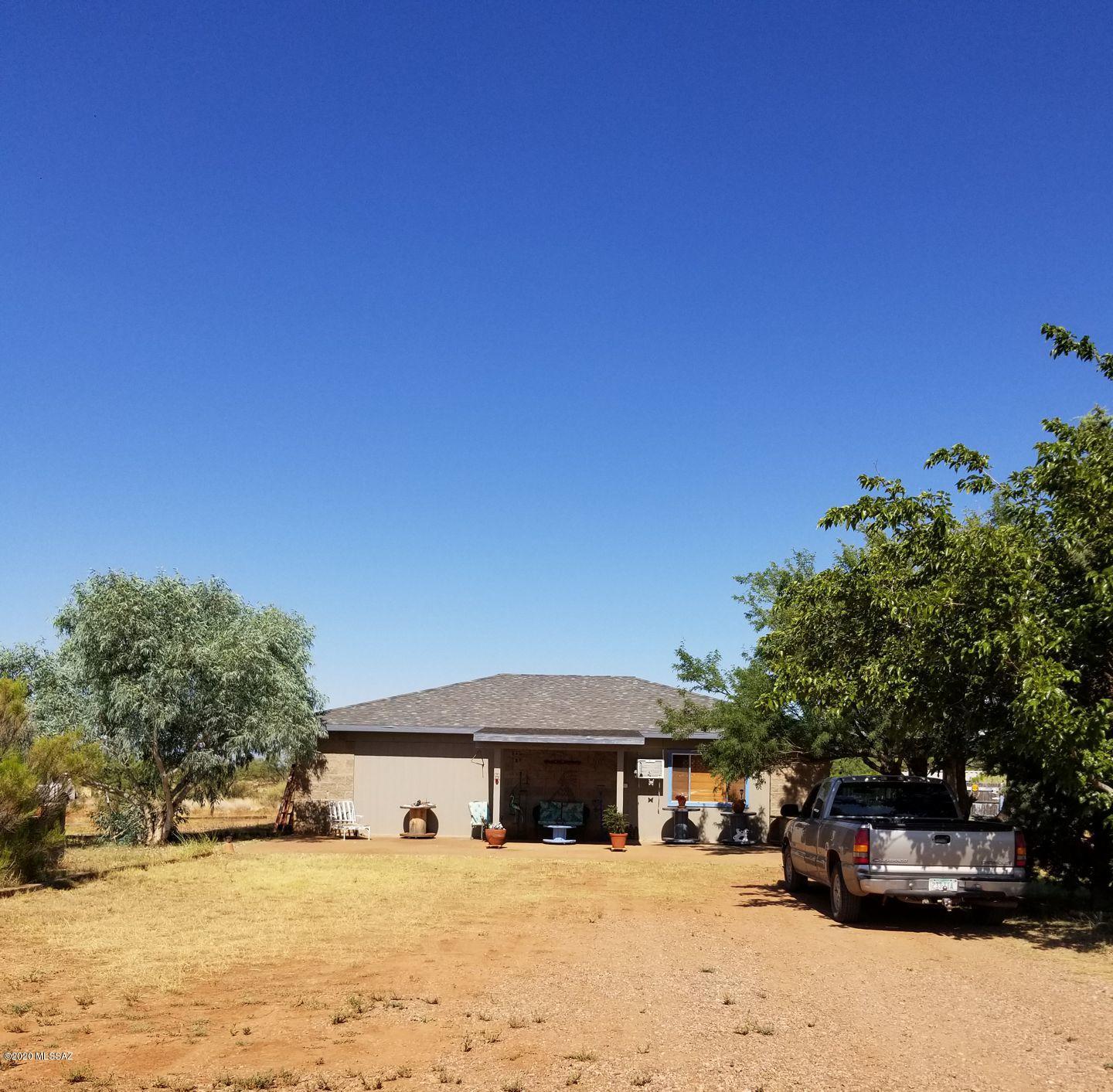 The property's previous owner (PO) had plans (available) and permits to build a site-built main two story house and a separate guest house on the property. 
The PO first built the guest house to be utilized as living quarters while constructing the main house. 
The PO installed the main house septic system and an approximate 2000 SqFt foundation w/stem wall before selling. These exist for the new owner.
The existing guest house is site-built and has separate septic and electrical systems from the intended main house. 
The property is 9.14 acres, mostly flat with a minor arroyo paralleling a local collector street to the north. The property is accessible from two paved roads.
Great western views of the Whetstone Mountains with access to the Coronado National Forest.