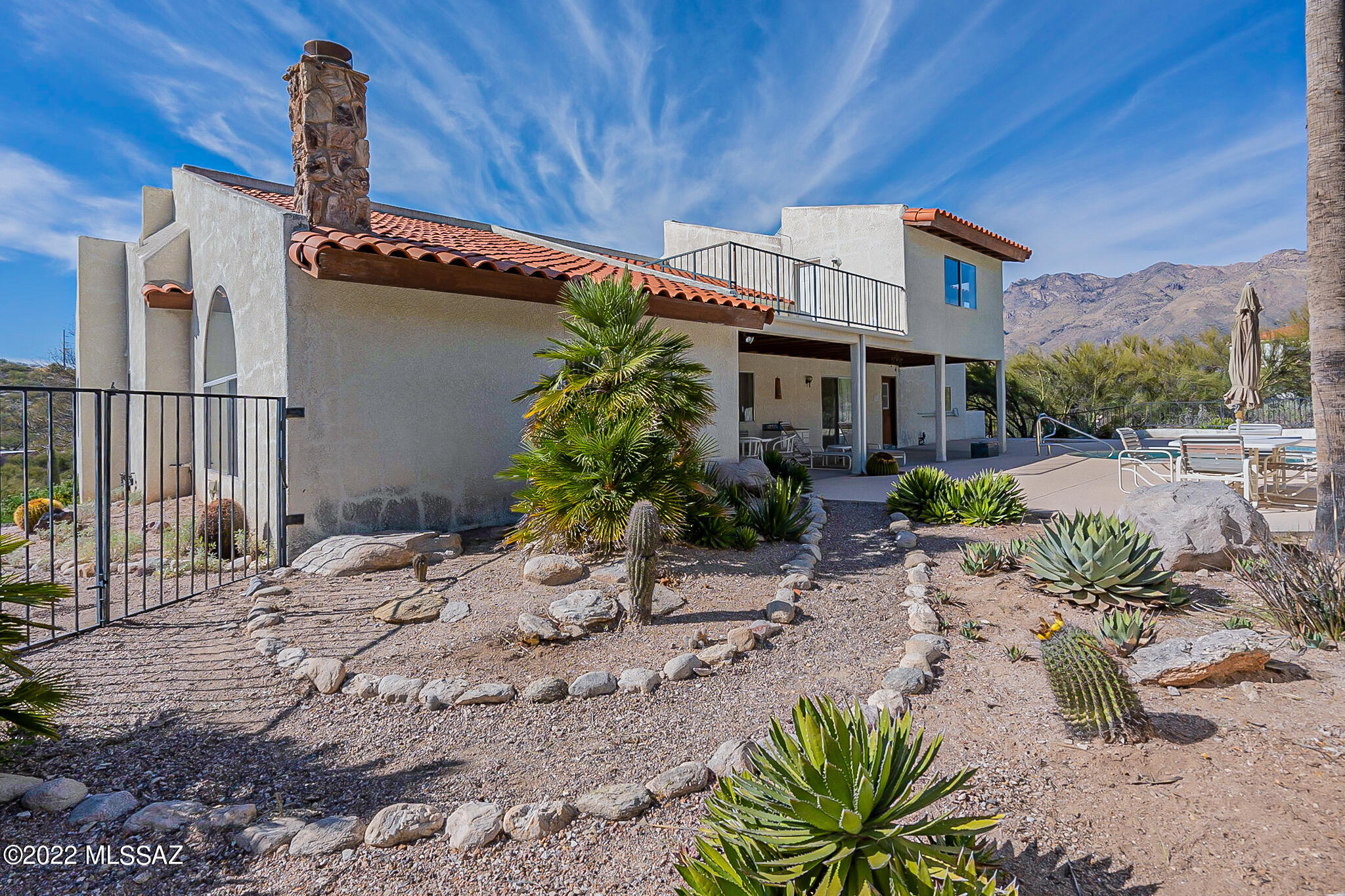 Fantastic opportunity to make this Hillside Sunrise Territory Village home your own! Double door entry into a wonderful 3 bedroom 2.5 bath home. Enjoy private pool, spa and Catalina views! Vaulted ceilings, family room with natural stone fireplace. Kitchen with granite countertops, island and eat in area/breakfast nook and built in desk. 2nd story private suite with North and East patios,  2 separate vanities, shower and separate jetted tub with a view and nice sized walk in closet.  3 car garage with very tall vaulted ceiling and storage. Needs updating and repairs: priced accordingly. Being sold AS IS.