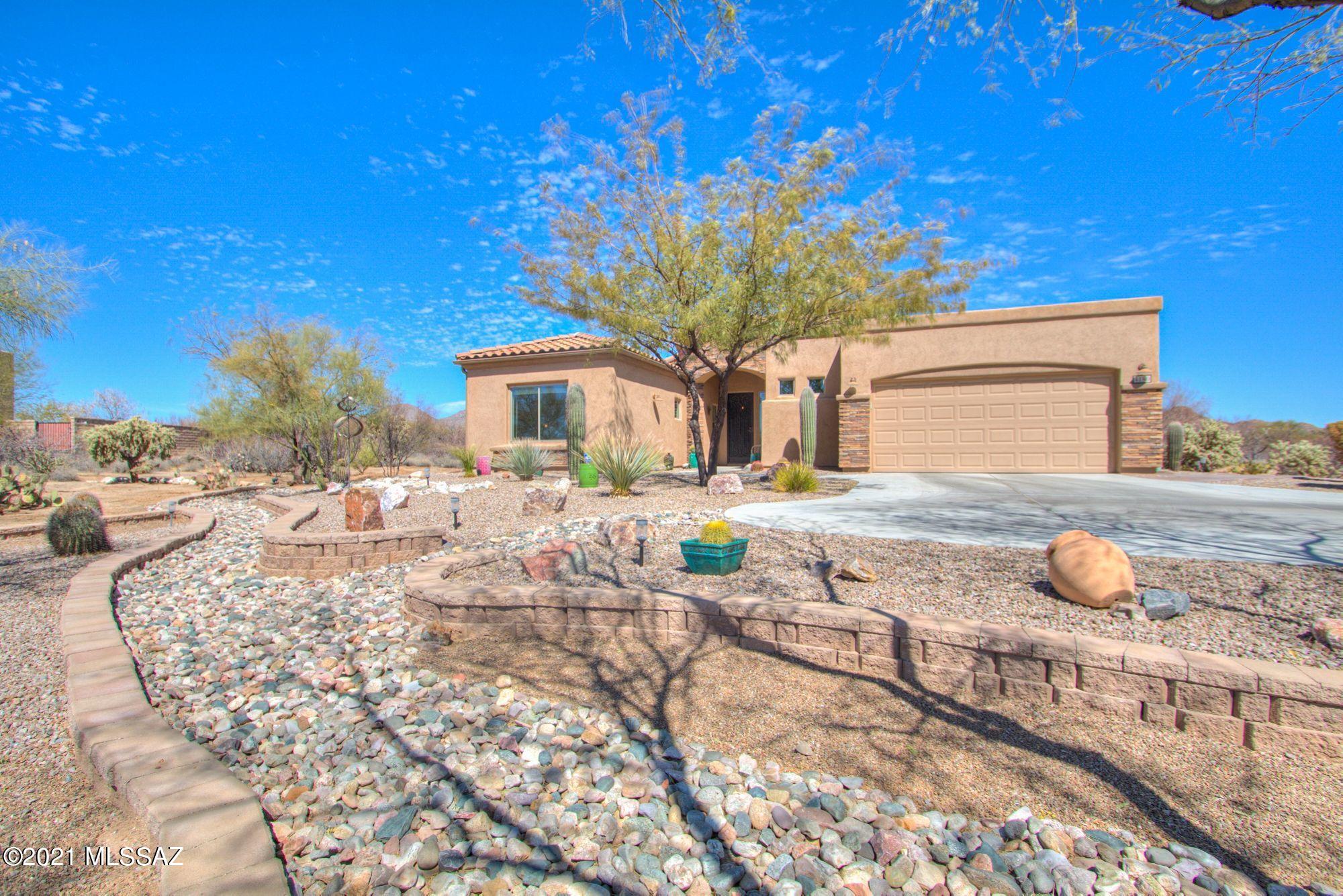 This is a ''MUST SEE'' luxury AF Sterling semi-custom home in the quiet Tortolita Vistas gated community which boast a pristine move in ready, split floor plan, low maintenance house with amazing extras and upgrades inside and out. You'll love the wonderful view of the mountains thru the wall of windows in this magnificent Atrium/Sun Room addition which has soaring ceilings, 4 skylights, porcelain wood plank floor and a HVAC/Heating Split System for your comfort year round. When you are to ready to cook you'll appreciate the large custom gourmet kitchen with upgraded higher grade quality granite countertops, deco glass backsplash, 5 burner gas on glass cooktop, built in electric over, under cabinet lighting, expresso stained oak cabinets, 42'' uppers, and lots of deep drawers.
