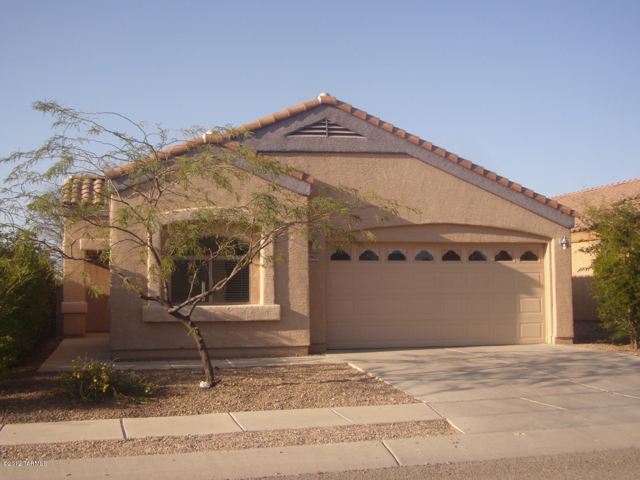 Charming and spacious 3 Bedroom 2 bath home in quiet West side neighborhood. Great location close to I-10, UofA, Pima Community College and downtown. Large great room floor plan with master bedroom separate from the guest bedrooms. Master bedroom has 2 closets (one walk-in) with double vanity sinks and garden tub in the master bath. Kitchen has toffee colored maple cabinets, Corian countertops, large pantry, & breakfast bar. Other features include decorative wrought iron security door at front entrance, wood blinds throughout, laundry room with washer & dryer hook-ups, alarm system installed, plus a covered patio and mature trees in the private back yard. Non-smoking home. No pets. 1 year minimum lease. $45 application fee per adult. Subject to credit approval. Renters insurance required.