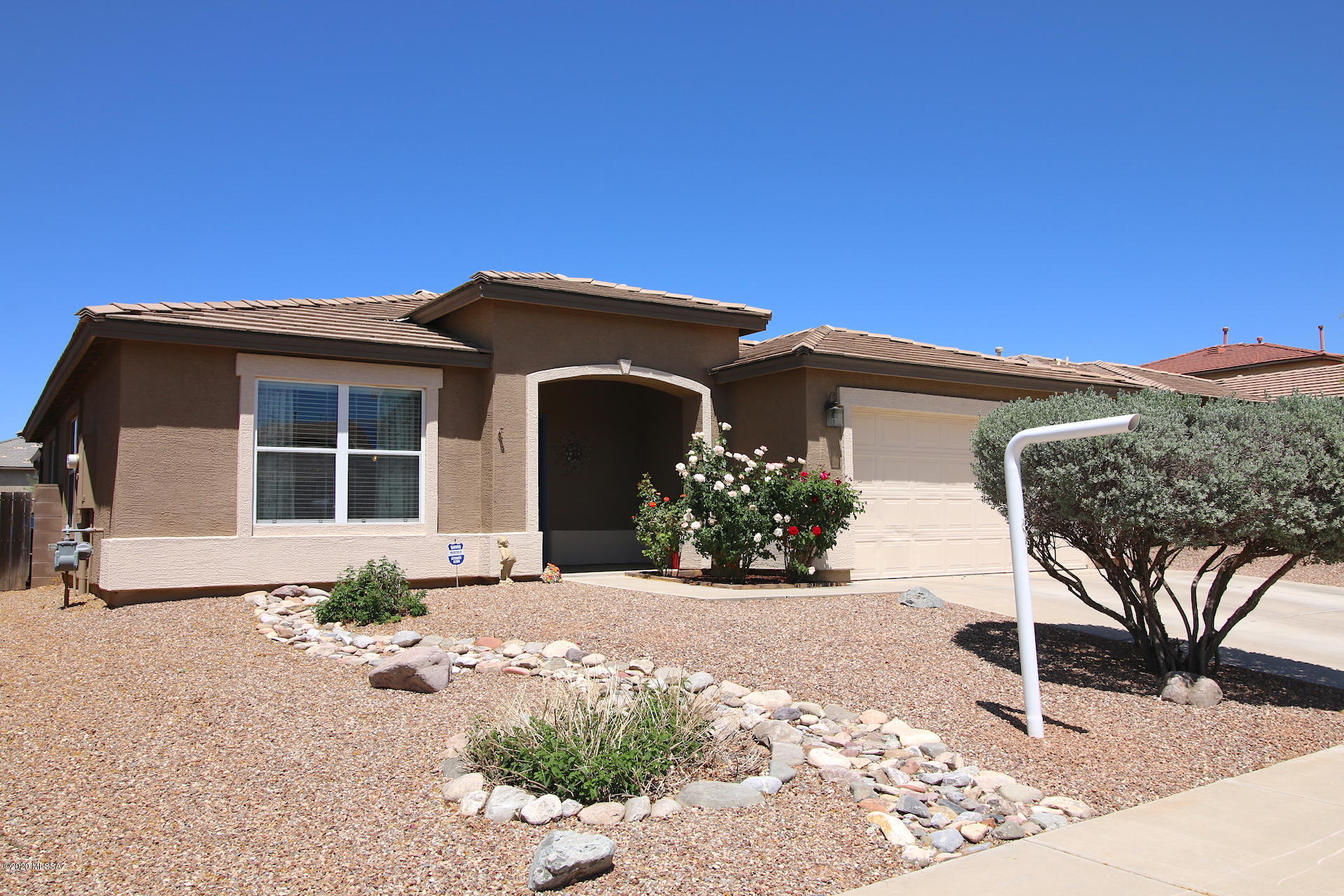 Pride of ownership in this well maintained 3 bdrm./2 bath + Den/Office/Exercise Room or possible 4th Bdrm. Large Living/Formal Dining Room is being used as a magnificent Craft/Hobby Room. Upgrades include granite counter tops in kitchen with custom tile back splash, many electrical outlets set-up with night lights, water softener, and both bathrooms have been updated with granite counter tops and vessel sinks.  The exterior has just been freshly painted and the current exercise room can easily be turned into a 4th bdrm. by adding a closet. Enjoy the mountain views while the kids play in the pool and the extra open space behind the house to the North. Close access to I-10, Davis Monthan AFB, plus being in the award winning Vail School District.