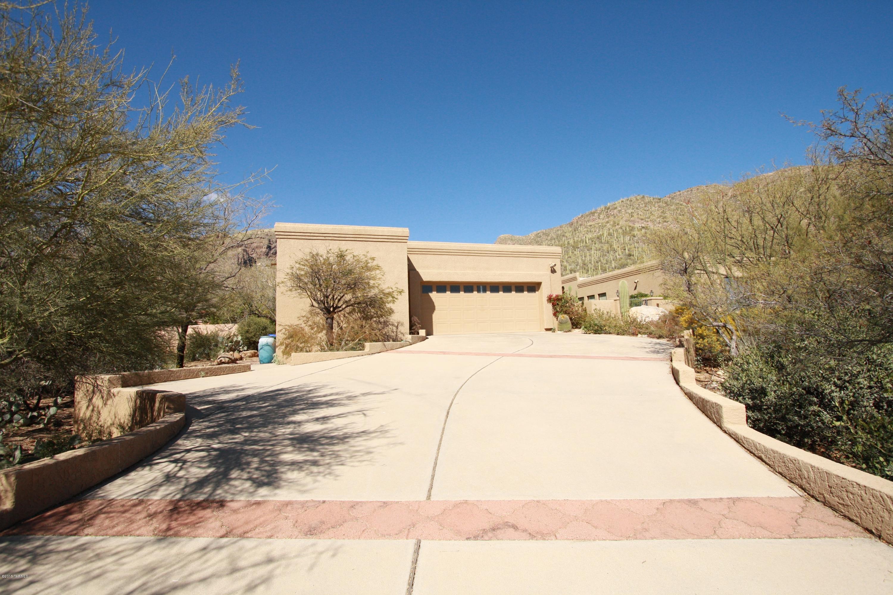 Beautiful 4bdr/3ba home in gated community of Sin Vacas! Stunning mountain views abound in this fabulous home, spacious master bedroom w/fireplace & patio. Master bedroom bath w/walk-in shower, garden tub and spacious closet.
Formal living room w/fireplace and vaulted ceilings, formal dining room, family room w/Fireplace, kitchen w/granite counters & both dining area and bar seating.
Tucson living at it's best w/stunning mountain views and sparkling pool.
POOL SERVICE INCLUDED.  LANDSCAPING SERVICE INCLUDED ON A QUARTERLY BASIS.