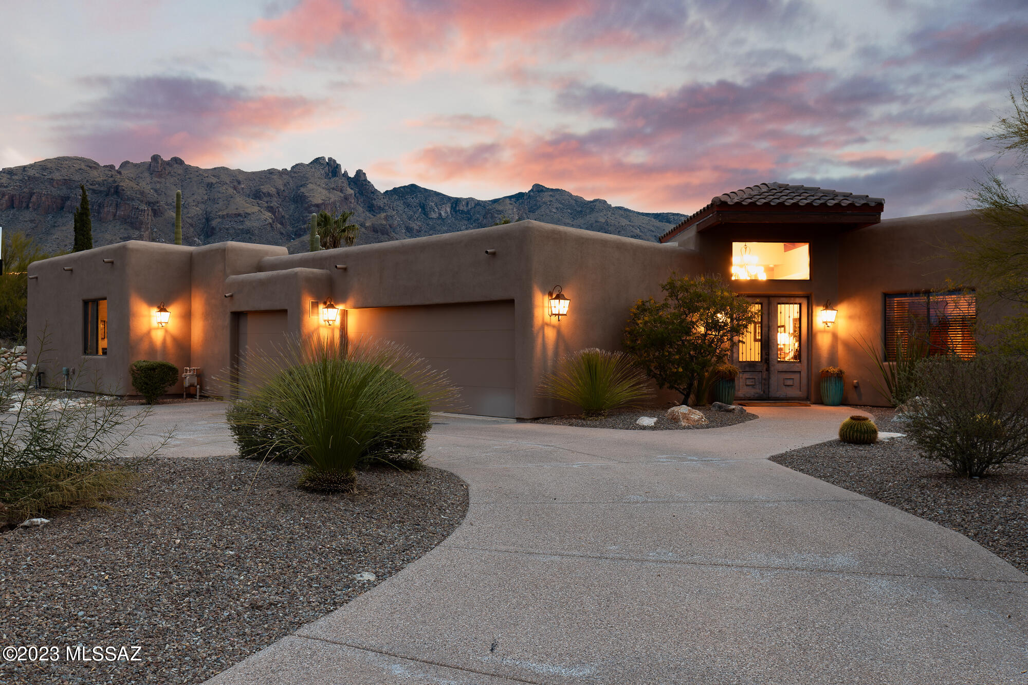 Beautiful southwestern contemporary with unparalleled panoramic views of the Catalina Mountains and natural desert beauty. With 4,782 Sq Ft and 5 bedrooms & 5 bathrooms, the single level, split floor plan offers generous space and private comfort & luxury. Sitting clandestinely in Catalina Foothills, the city lights and panoramic Catalina Mountain views are prominently featured with Finger Rock framed immaculately. Travertine tile floors are featured throughout the common spaces and spacious primary bedroom. The backyard is surrounded by serene desert landscape & features resort-style amenities that provide perfect relaxation & entertainment options: infinity edge pool overlooking a valley of natural desert, outdoor shower, putting green, gas fireplace, bar area & dining space under the large covered patio.

The primary suite is positioned with direct access to the backyard and is its own large retreat with over 500 Sq Ft of space and a resort-like ensuite primary bathroom that doubles as a 350 Sq Ft workout room with a large walk-in closet, separate shower, and jetted tub. The living room provides the perfect entertainment space or private enjoyment, with gas fireplace, and built-in cabinetry with a tap, Sub Zero refrigerator drawers and wine cooler.

Just off the living room and primary suite, is a guest bedroom that could be utilized as an office space with an adjacent full bathroom. Three additional guest bedrooms, all with ensuite bathrooms, on the opposite side of the home, creating a secluded guest wing with an activity room perfect for homework, playroom or den.

The kitchen and family room are well thought out for both entertainment and intimate family gatherings. Built-in refrigerator and high-end appliances complement the cook's kitchen. Six burner gas cooktop with griddle and double ovens provide all the cooking resources for an epic meal. The family room is an open space off the kitchen with an abundance of natural light and commanding mountain views.

The home is in a phenomenal location with District 16 schools, walking distance to La Encantada and Manzanita Elementary, and direct access to Joesler Village, La Paloma Country Club and downtown. Countless details and character throughout with a high level of maintenance in this one owner home built in 2011. 3-car garage with additional storage and flat driveway with guest parking spaces.

Catalina Foothills, located in the Santa Catalina Mountains just north of Tucson, Arizona, is known for its stunning natural beauty and desirable living conditions.

Scenic Views: The area offers breathtaking views of the Sonoran Desert, city lights, and the surrounding mountain ranges. Residents enjoy picturesque landscapes and sunsets.

Outdoor Recreation: Catalina Foothills provides easy access to outdoor activities such as hiking, biking, and bird watching in the Catalina State Park and Sabino Canyon Recreation Area.

Mild Climate: The region experiences a mild climate with warm temperatures during the winter months and cooler temperatures in the summer due to its higher elevation. This appeals to those who prefer a more temperate climate compared to the intense heat of the desert floor.

Upscale Living: Catalina Foothills is known for its upscale neighborhoods, luxurious homes, and a high standard of living. The area attracts professionals, retirees, and individuals seeking an affluent lifestyle.

Cultural Attractions: Tucson, located nearby, offers a vibrant cultural scene with museums, galleries, and events. Residents of Catalina Foothills can easily access these cultural attractions.

Quality Schools: The area is home to reputable schools, making it attractive to families seeking quality education for their children.

Proximity to Amenities: Catalina Foothills is close to shopping centers, restaurants, and entertainment options. Residents can enjoy the convenience of urban amenities while living in a more serene environment.

Community Atmosphere: The community in Catalina Foothills often emphasizes a relaxed and friendly atmosphere. Many residents appreciate the sense of community and the opportunity to connect with like-minded individuals.

Health and Wellness: The region attracts individuals interested in a healthy and active lifestyle. The availability of outdoor activities and wellness-focused amenities contributes to a health-conscious community.

Investment Value: The desirability of living in Catalina Foothills has led to a stable real estate market. Homes in the area often maintain or appreciate in value, making it an attractive option for those looking at real estate as an investment.

Overall, the Catalina Foothills offer a combination of natural beauty, outdoor activities, upscale living, and a strong sense of community, making it an appealing place for many individuals and families to call home.