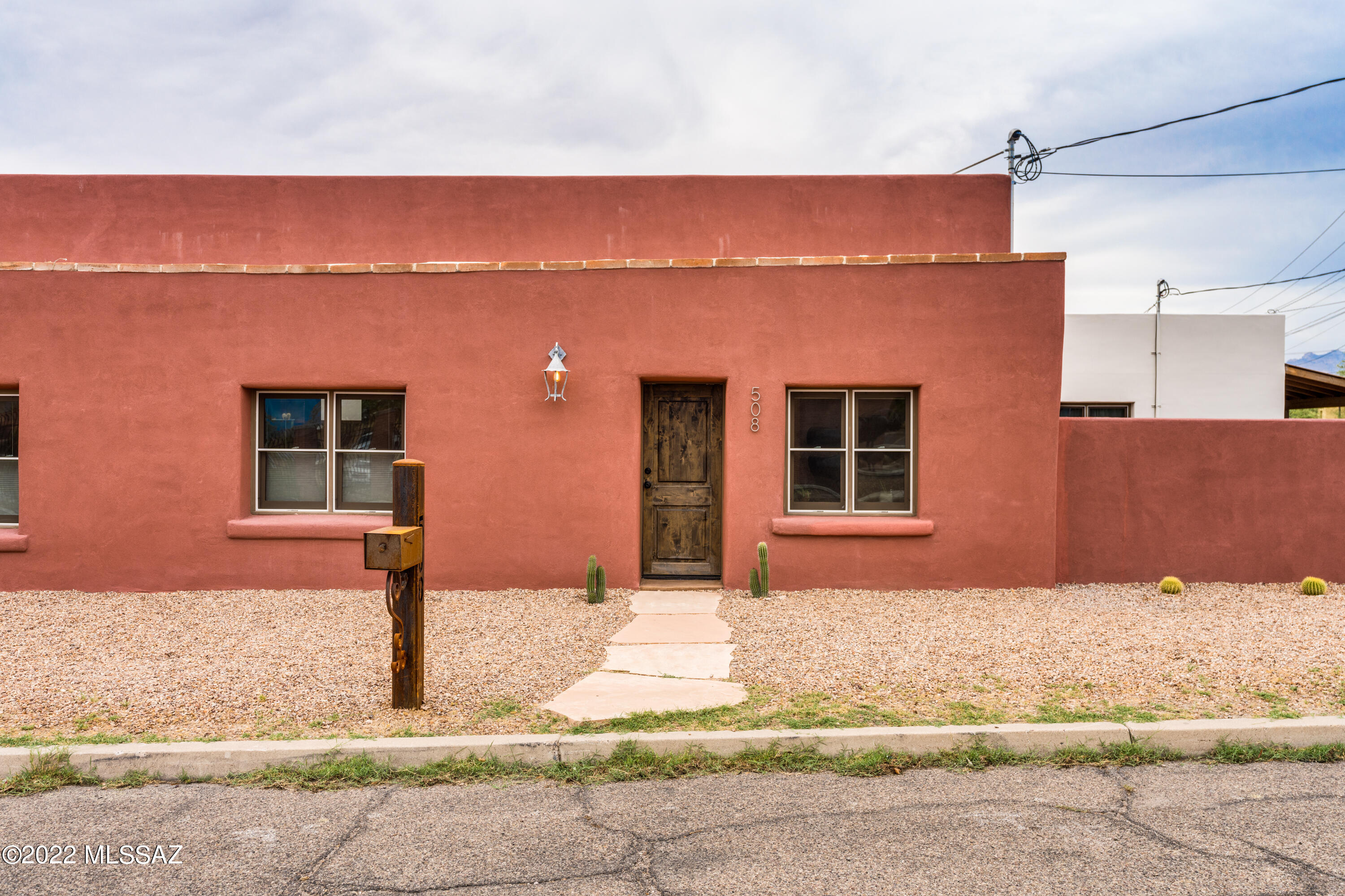 Walk into Equity, Incredible Price Adjustment, Jump on the opportunity to own in the Historical Barrio Viejo. 2-year-old new construction on large lot that preserved and incorporated the historic adobe façade of the original house on the property (circa 1915) into the front of the brand new house (visible through interior cut-out feature). Enter through the original  door way. Home features 3 bedrooms, den, 2 baths, 2 patios, large yard & gated parking area. High ceilings, lots of windows and light, high-quality finishes, granite countertops, with concrete overly flooring. Refrigerator, W/D included. Close to Downtown, TCC, museums, The Mercado/MSA Annex, A Mt., The Loop bike trail. and many restaurants like 5Points, The Coronet, The Delta and many more