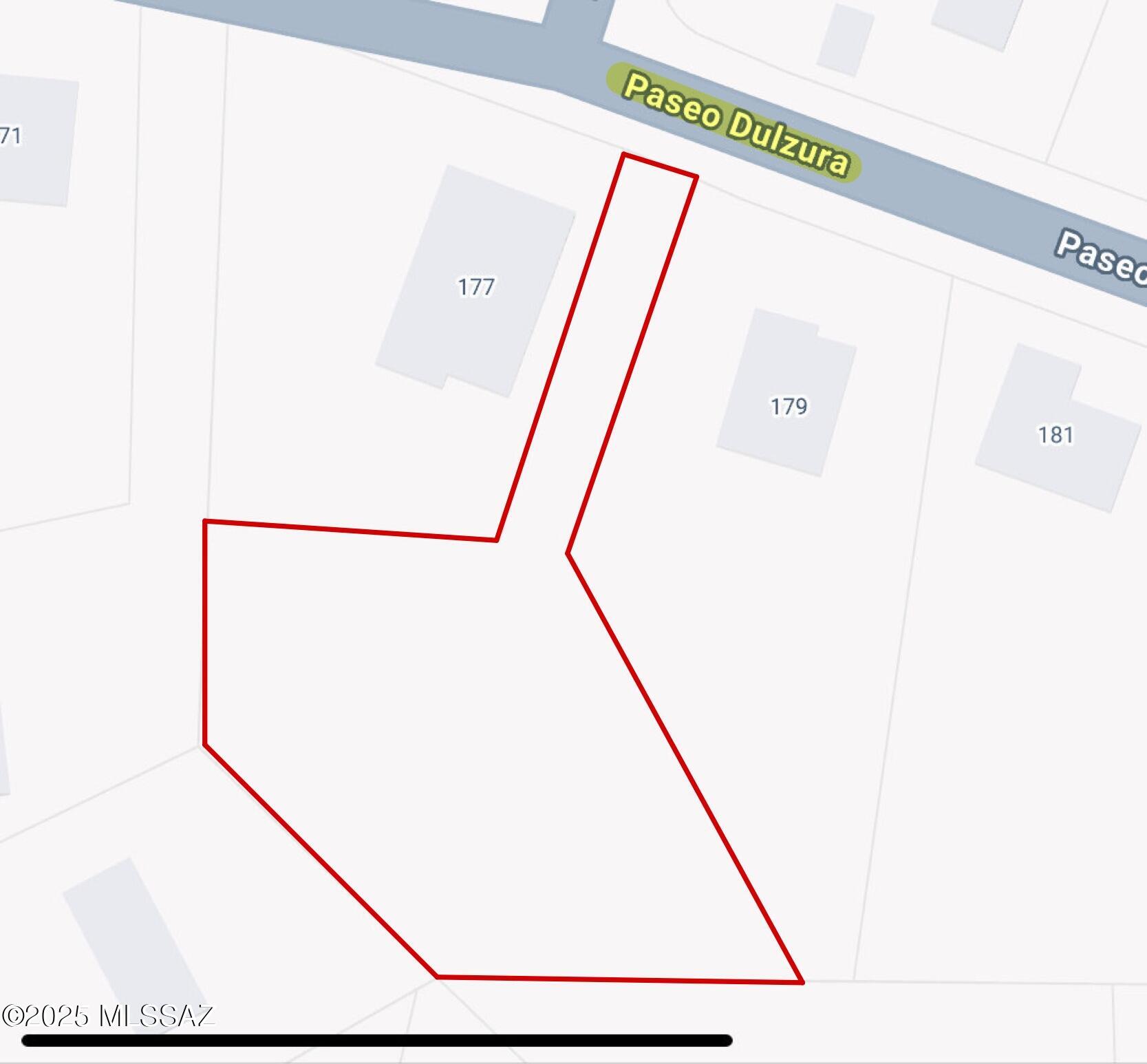 This 0.69 acre lot has direct road access with a road-like driveway entry between two homes before opening up to a buildable area. Water & electric are available for hookup. Terrain is partially flat with some slope - grating possibly necessary for building. Well suited for custom home or home builder.