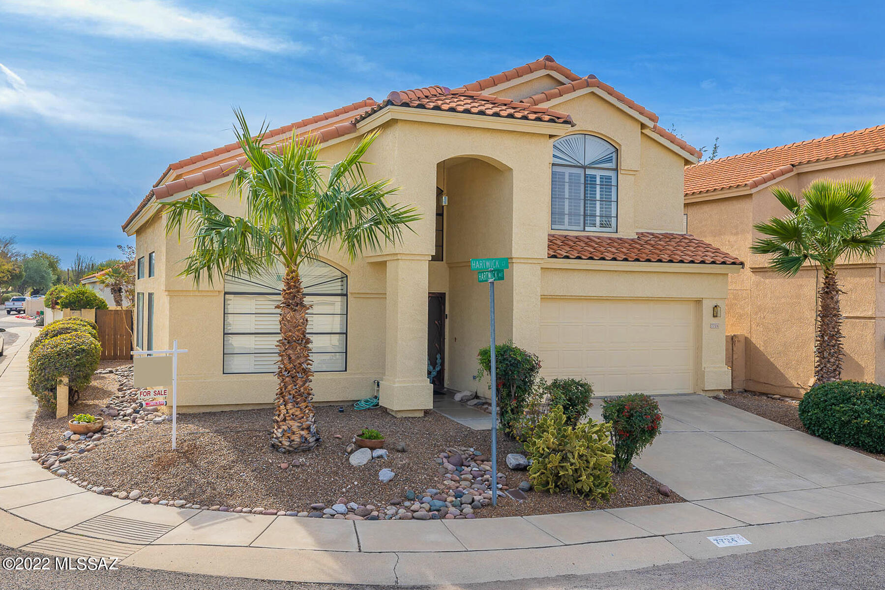 Well maintained 4 bedroom home nestled in the ''The Enclave'' on a corner lot of a quiet cul-de-sac with a heated pool and spa. Separate living room with high vaulted ceilings and focal point staircase.  Plantation Shutters through the home. Family room that opens to the large kitchen with lots of storage cabinetry and offers access to the backyard and pool.  All bedrooms are on the second story with a large owner's suite.  Two car garage with cabinets and overhead storage. Easy access to the River Walk for bike riding or leisurely strolls along the Tanque Verde Wash