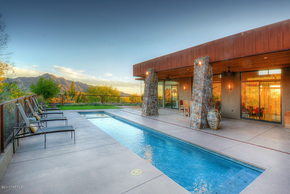 REDUCED PRICE ON 40.87ACRES - Rail X Ranch Estates - a well established gated community located in SE AZ's wine & ranch country rich in the history of the great American West. Approx. 1 hr from Tucson/Tucson Int'l airport, this exquisite country estate is of contemporary design with a blend of old world charm, highly appointed throughout w/majestic windows capturing views from every room of surrounding mountain ranges. Entertain in the gourmet kitchen and formal DR or outdoors by the evening glow of the lap pool with a backdrop of wondrous sunsets. You can hike or ride your horses to the nearby Nat'l forest and treat family & friends to the 2BR/1BA guest wing, the theater style media room, porches, & courtyardS. ADJACENT 41.5 ACRES (PARCEL 110-60-014) MAY BE PURCHASED AT ADD'L PRICE.