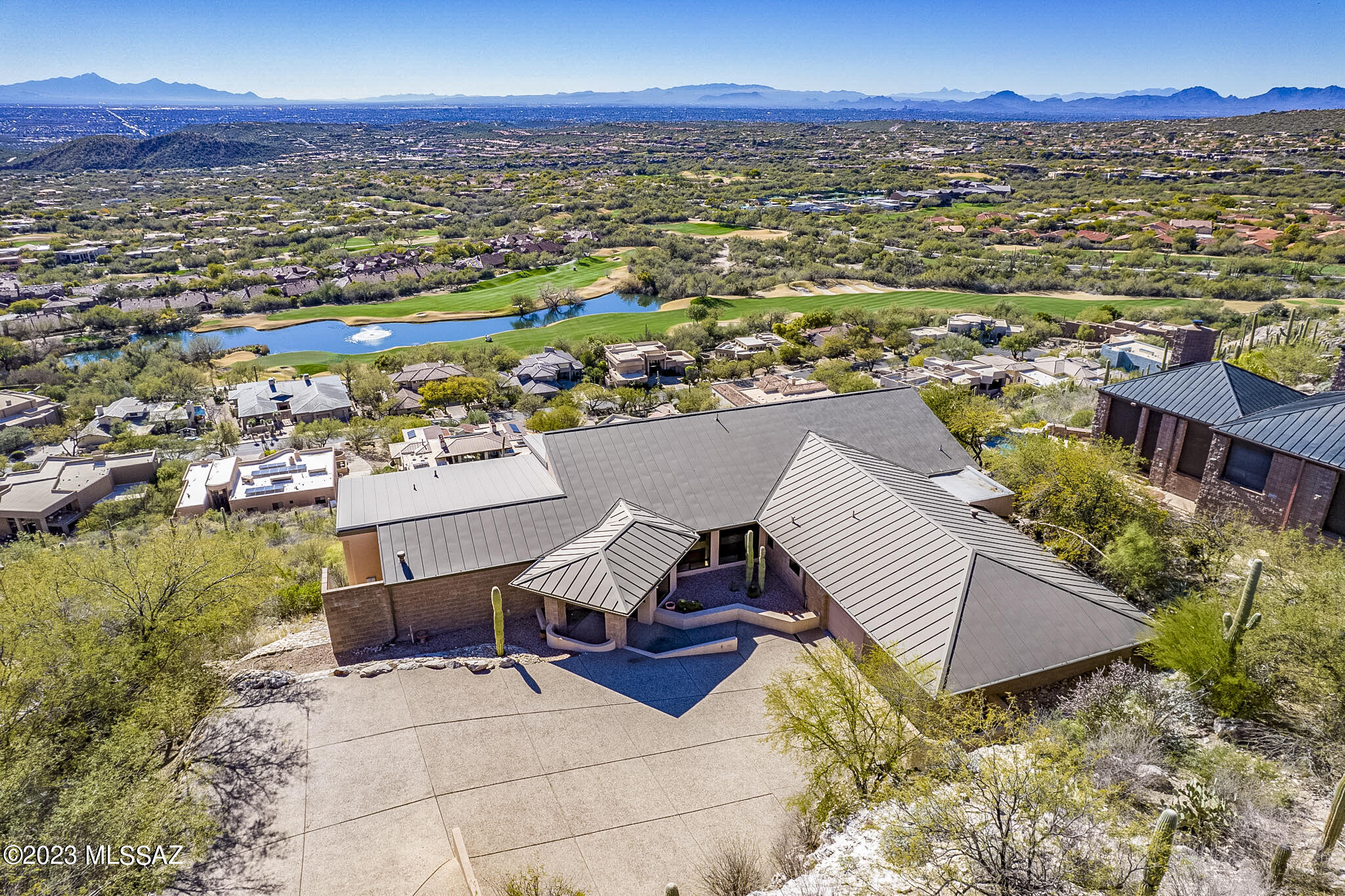 Incredible City, Mountain, Golf Course, & Valley Views From This Custom Built Modern Home in Coveted Ventana Canyon Mountain Estates.This 3BR/3BA Steel/Block Constructed One Level (no steps)Home Was Built in 1999 by Milestone Homes (Eric Freedberg). Features Include: Open Floor Plan, High Ceilings, Walls of Glass, Scored Concrete Floors, Gallery Style Walls for Artwork, Primary Suite w/ Dual Baths & Closets, Large Storage Closets, Deep Covered Patio w/ Kitchen, & Oversized 2 Car Garage. NO POOL! - Designed For Low Maintenance ''Lock n Go'' Luxury Mountain Living. Priced to Accommodate Updating Interior Finishes/Mechanics. Estate Sale.