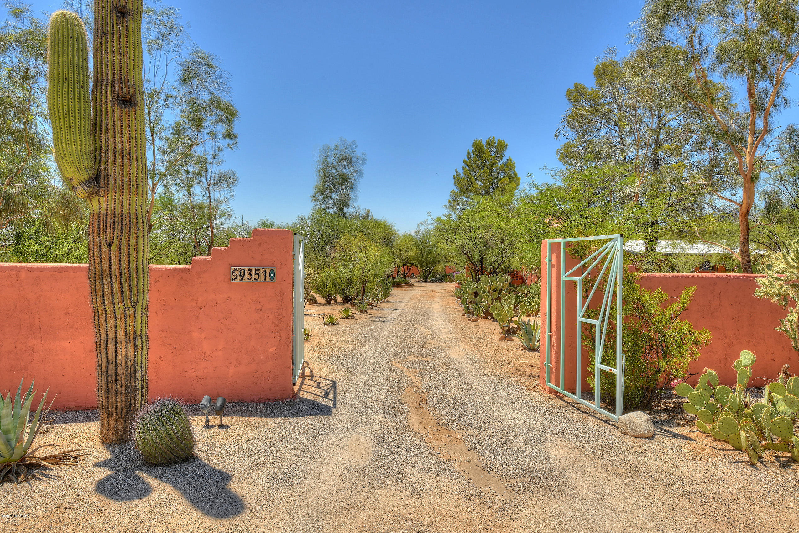 Step through one of the many azure gates hand crafted by Tucson local, Simon Donovan. Once inside you will get
your first glimpse into this Santa Fe paradise. The perfect mix of desert and botanical ambiance awaits. Main home with 3 bedrooms/3 bathrooms. 2 large guest houses, a studio perfect for a writer/artist/yoga as well as 380 sq ft office/living space are located on the property. Every living area has access to the sparkling pool and stunning mountain views so whether you are looking for a family compound, Bed and Breakfast or income
property this home HAS IT ALL! Currently operating as a B&B, your turn-key business or family paradise welcomes you!
*Commercial listing ( Property w/ business) will be listed via separate MLS entry at a separate sales price.